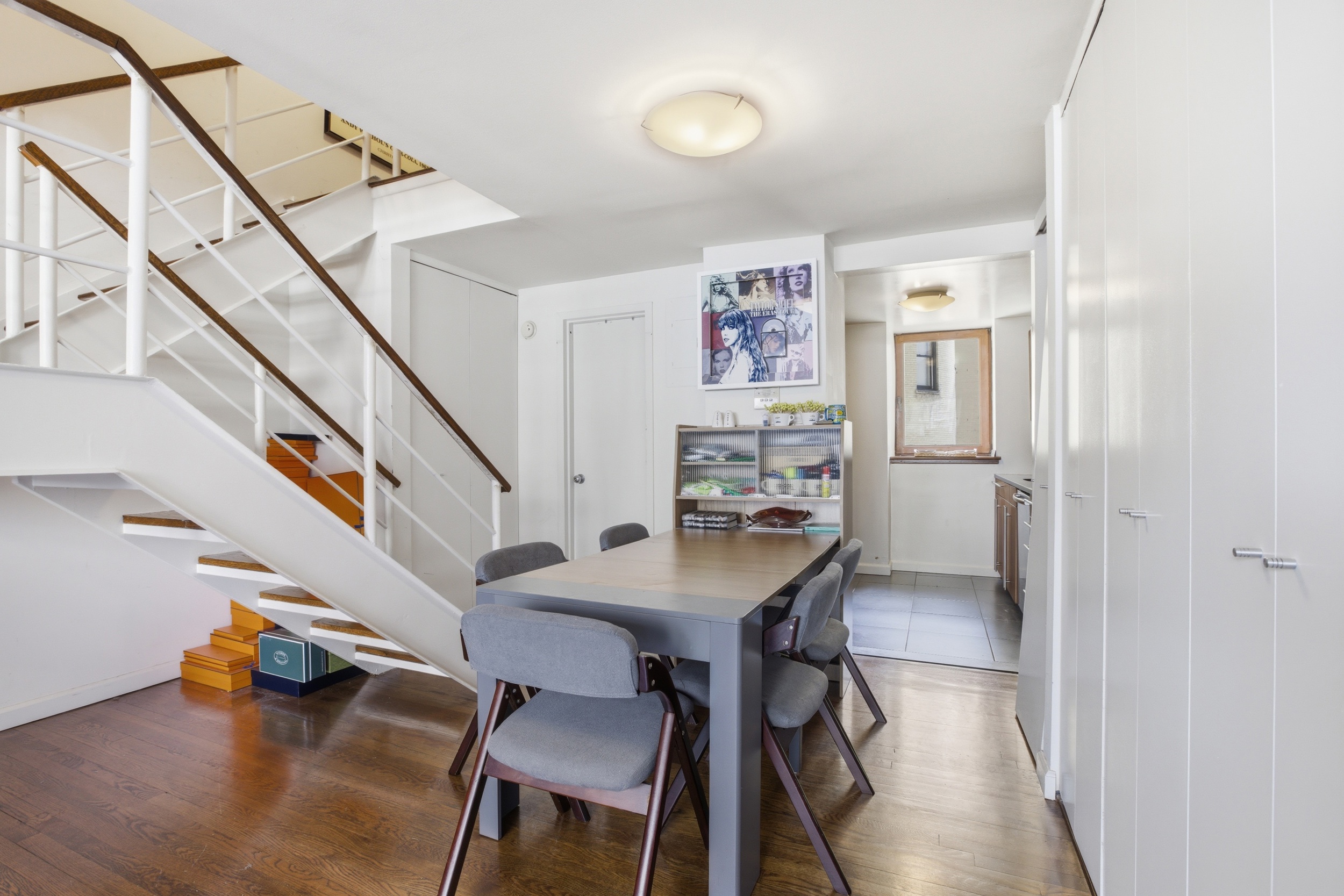 305 2nd Avenue, Unit 518 Manhattan, NY 10003 - Photo 6 of 19 a dining room with furniture and wooden floor