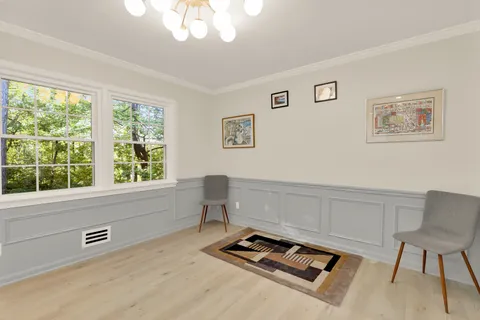 a view of a dining room with furniture window and outside view