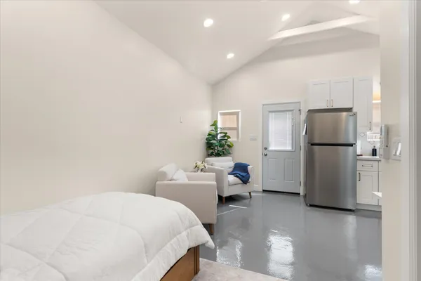 a kitchen with stainless steel appliances a refrigerator stove and microwave