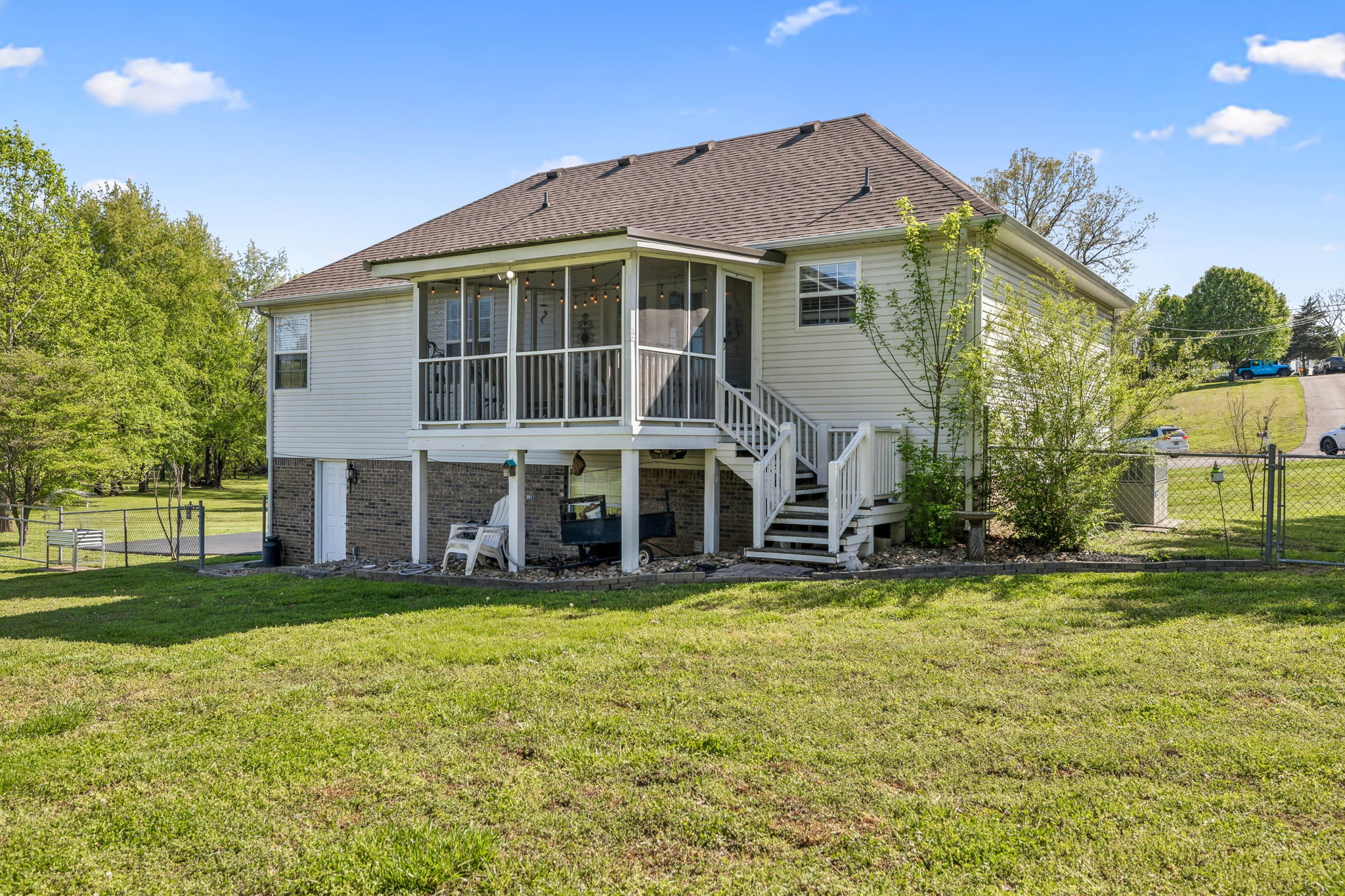 405 Billy Lane Spring Hill, TN 37174 - Photo 29 of 39 a large house with a big yard and large trees