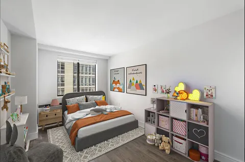 a bedroom with a bed furniture and a window