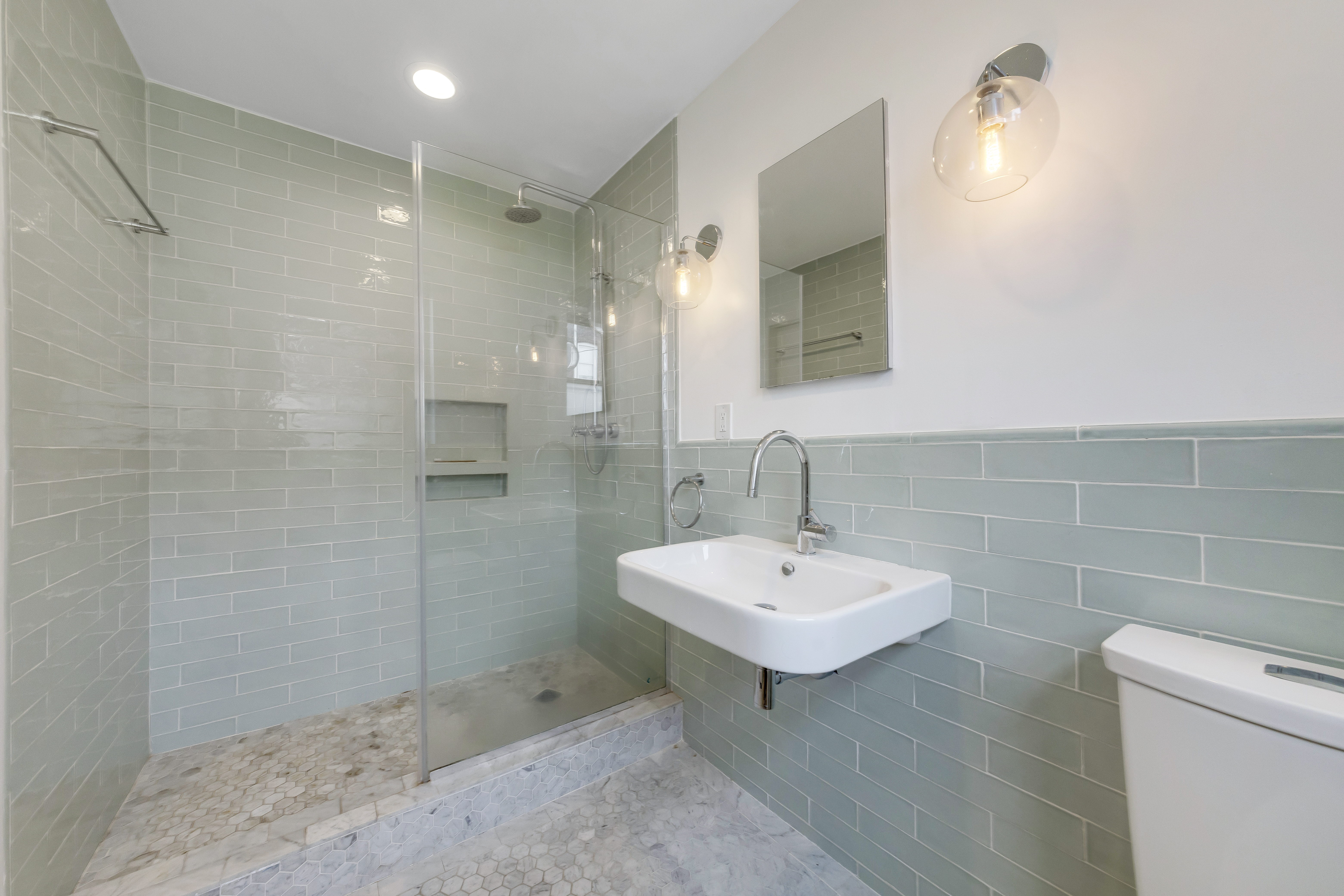 57 Hendrix Street, Unit 1 Brooklyn, NY 11207 - Photo 6 of 12 a bathroom with a sink toilet and shower