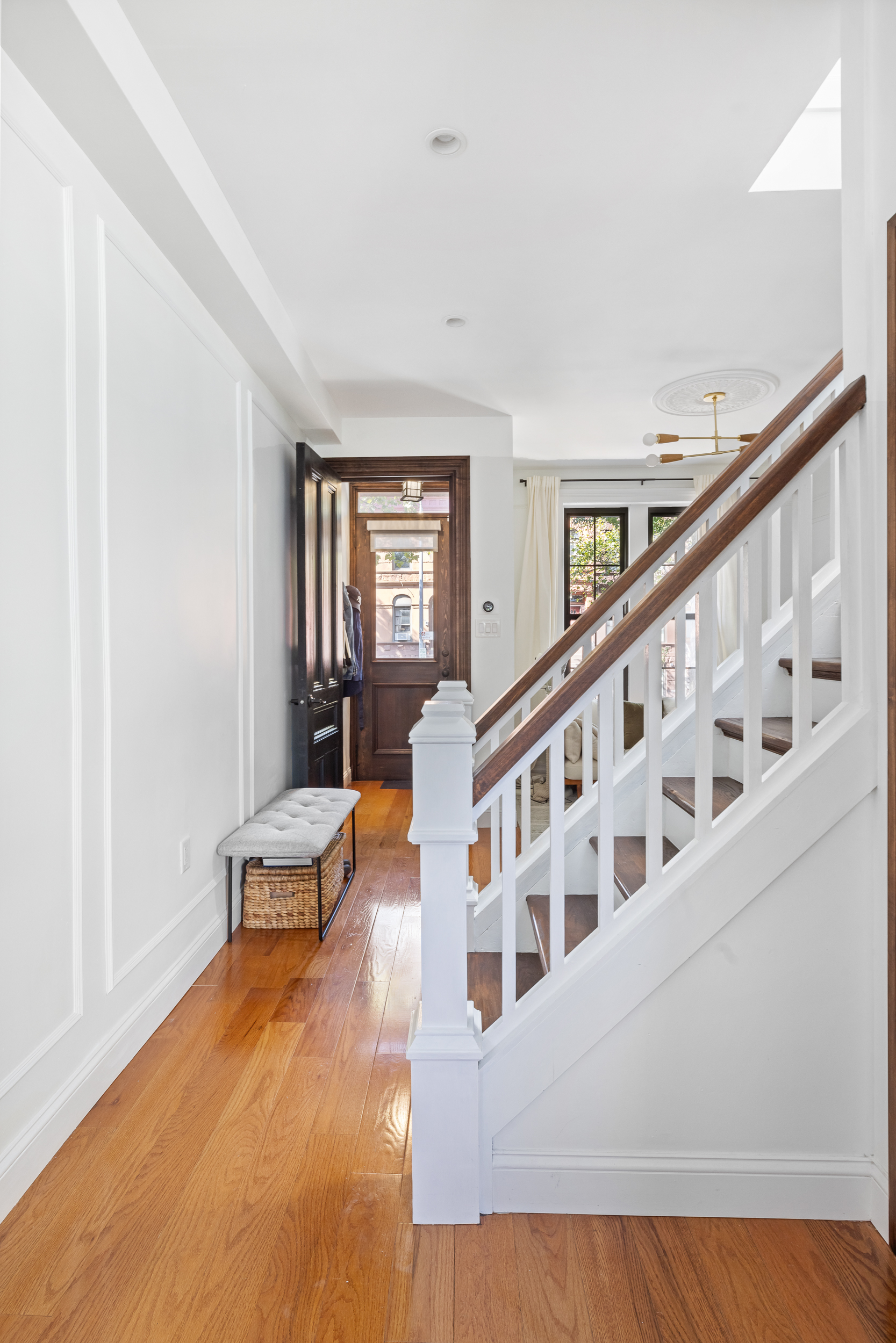 716 Monroe Street Brooklyn, NY 11221 - Photo 8 of 22 a view of an entryway with wooden floor and windows