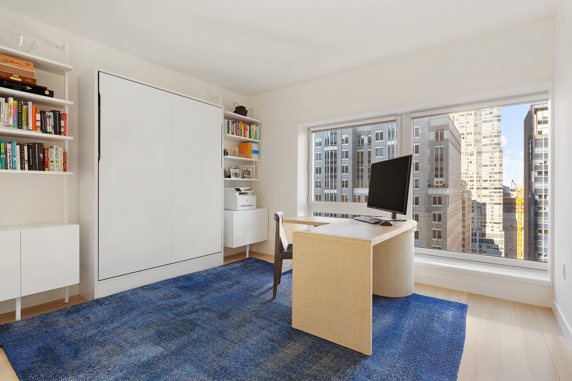 135 West 52nd Street, Unit PH3 Manhattan, NY 10019 - Photo 15 of 17 a view of work space with wooden floor and furniture