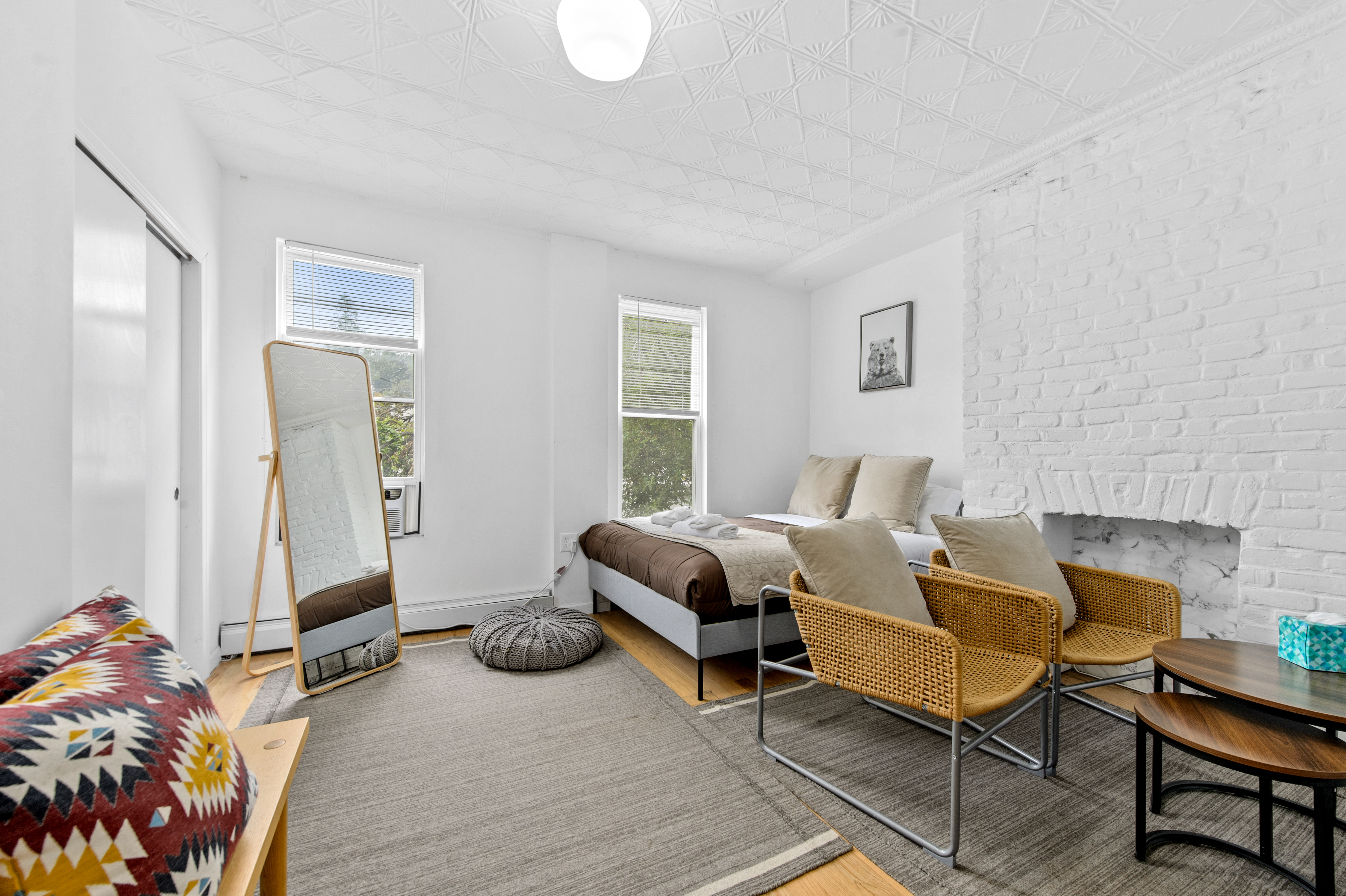 185 A Powers Street, Unit 1 Brooklyn, NY 11211 - Photo 1 of 13 a living room with furniture and a window