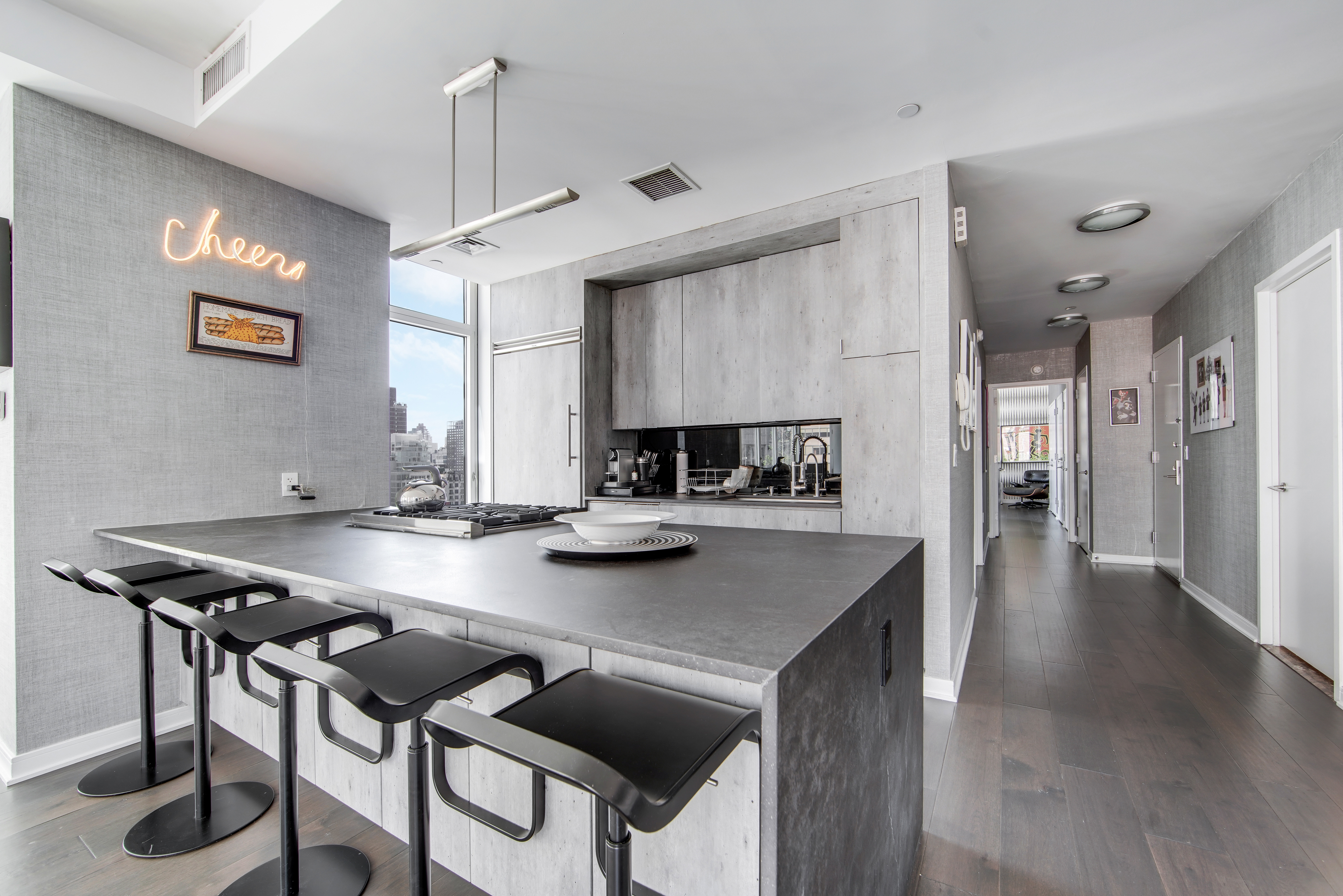 207 East 57th Street, Unit 20A Manhattan, NY 10022 - Photo 5 of 18 a kitchen with a table and chairs in it