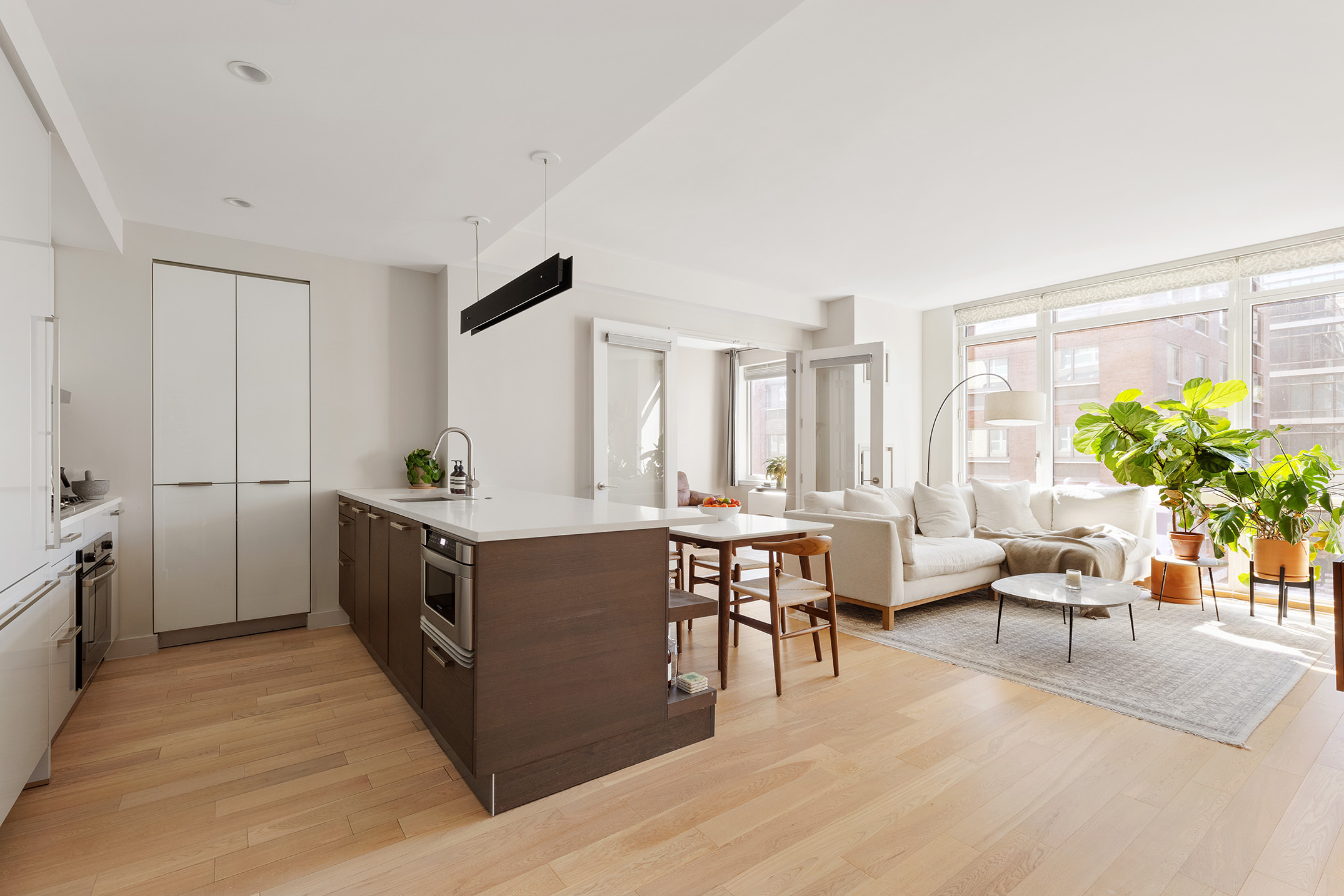 22 North 6th Street, Unit 4P Brooklyn, NY 11249 - Photo 2 of 12 a kitchen with stainless steel appliances granite countertop a stove a sink dishwasher and a refrigerator with wooden floor