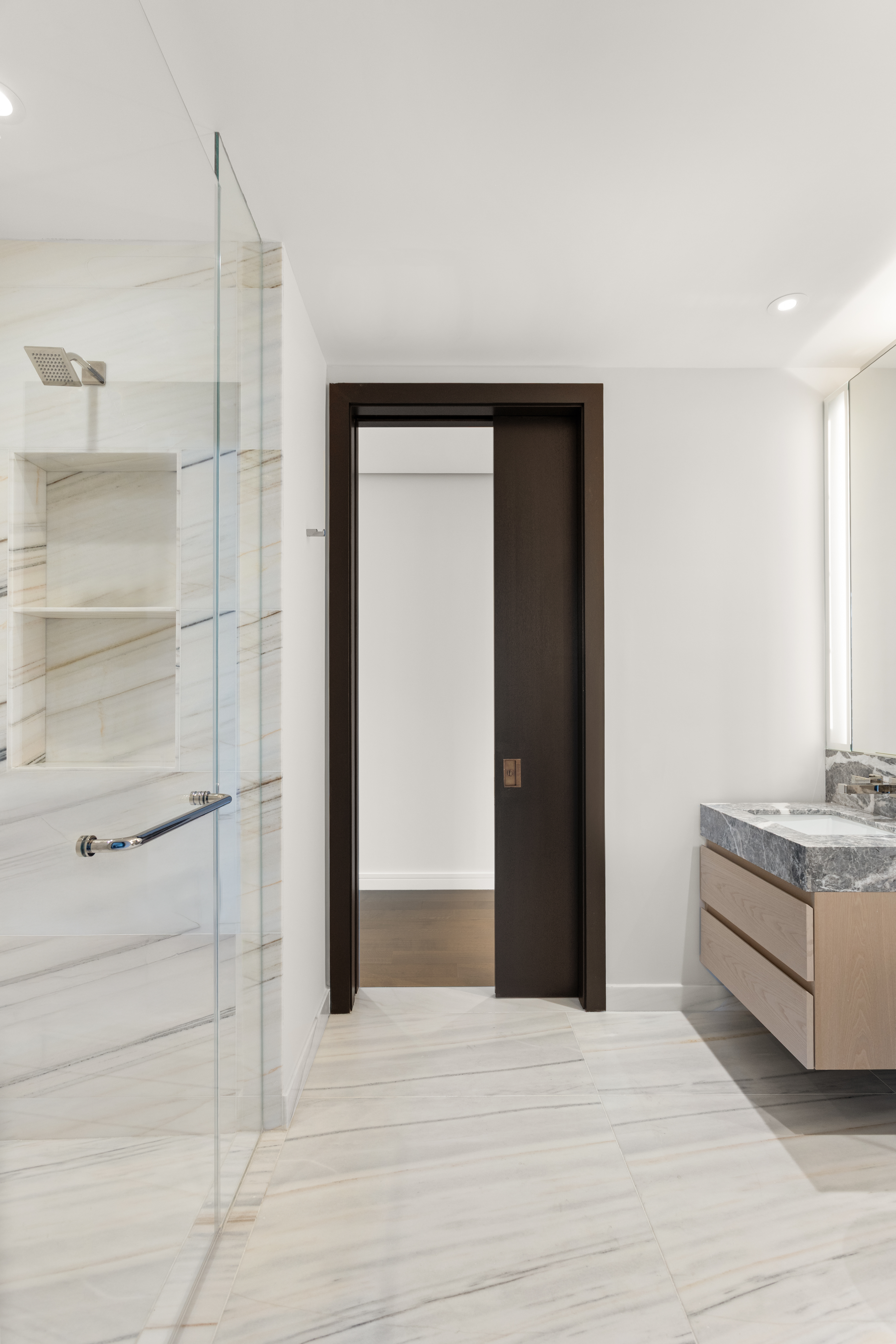 125 Greenwich Street, Unit 31A Manhattan, NY 10006 - Photo 13 of 23 a view of an empty room with cabinet and mirrors
