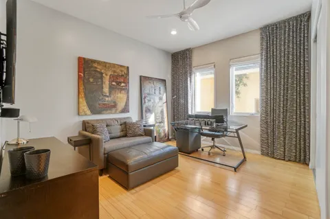 a bathroom with a granite countertop sink a mirror and a shower