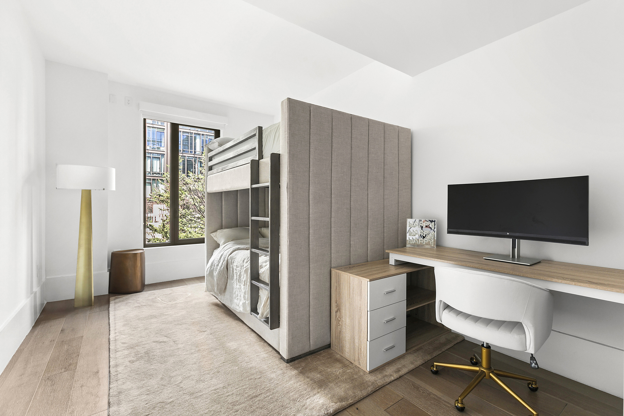 429 Kent Avenue, Unit TH8 Brooklyn, NY 11249 - Photo 13 of 24 a view of a livingroom with workspace and a window