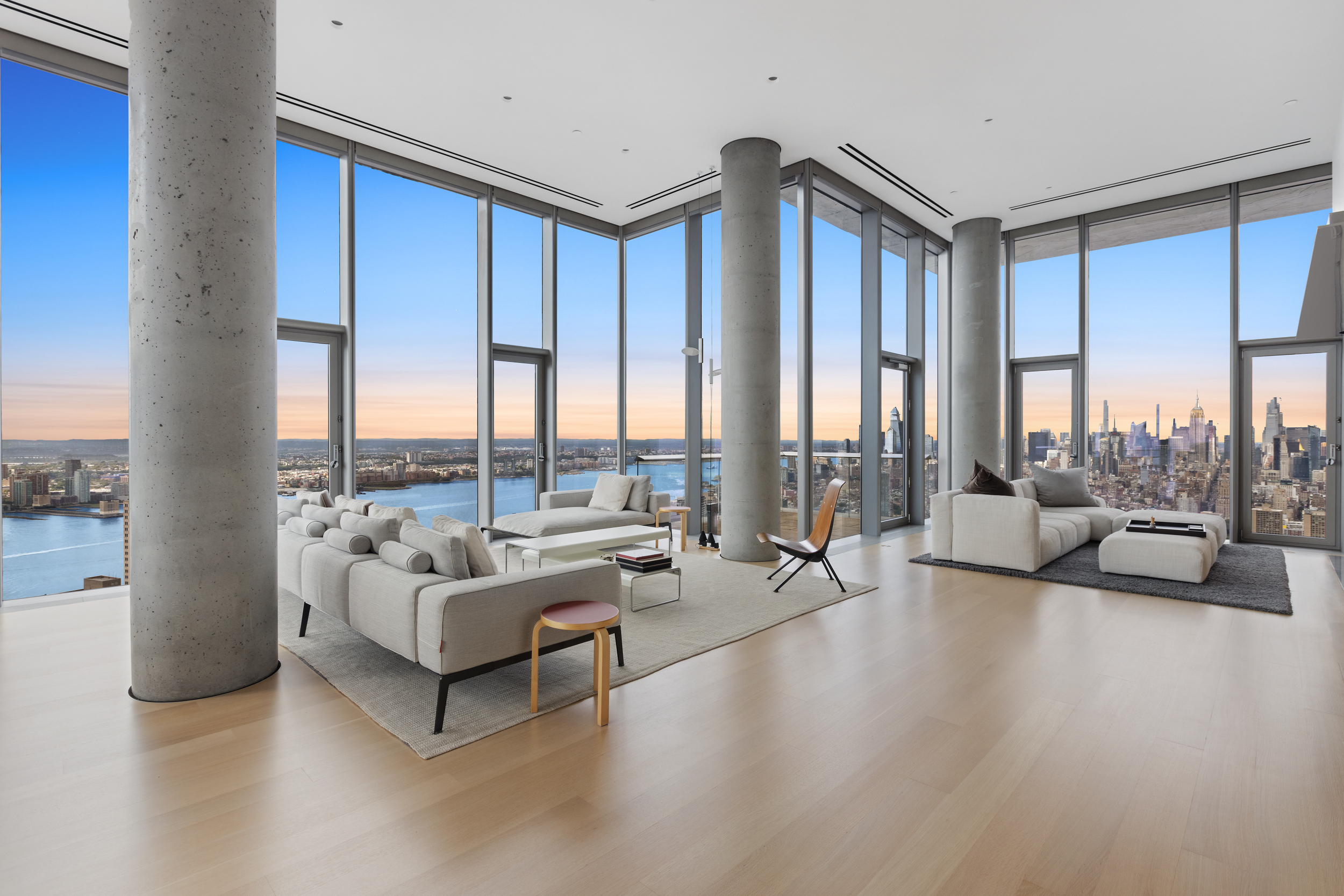 56 Leonard Street, Unit PH52A Manhattan, NY 10013 - Photo 2 of 24 a living room with furniture and a large window