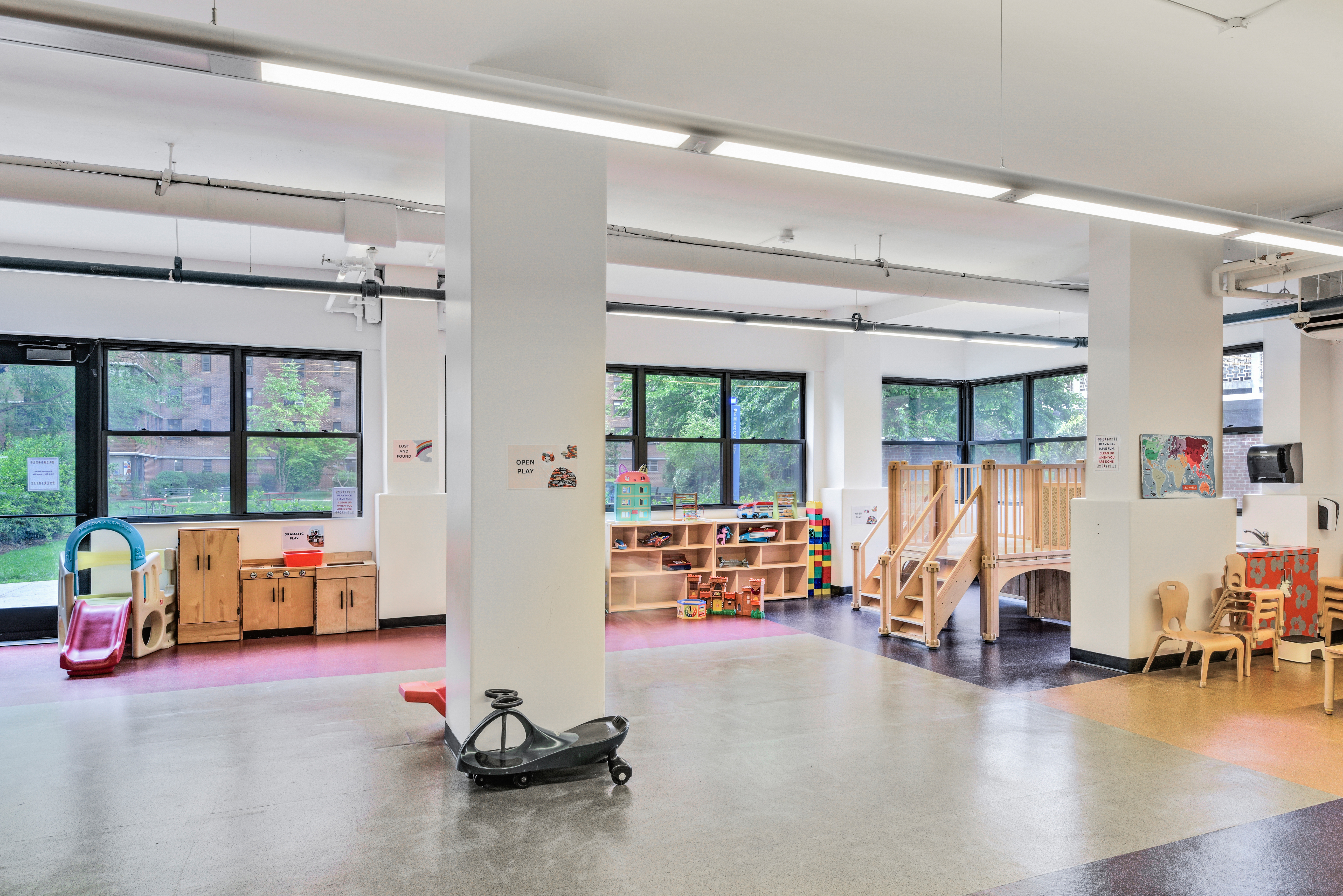 208 East Broadway, Unit J1304 Manhattan, NY 10002 - Photo 14 of 19 a living room with furniture and a large window