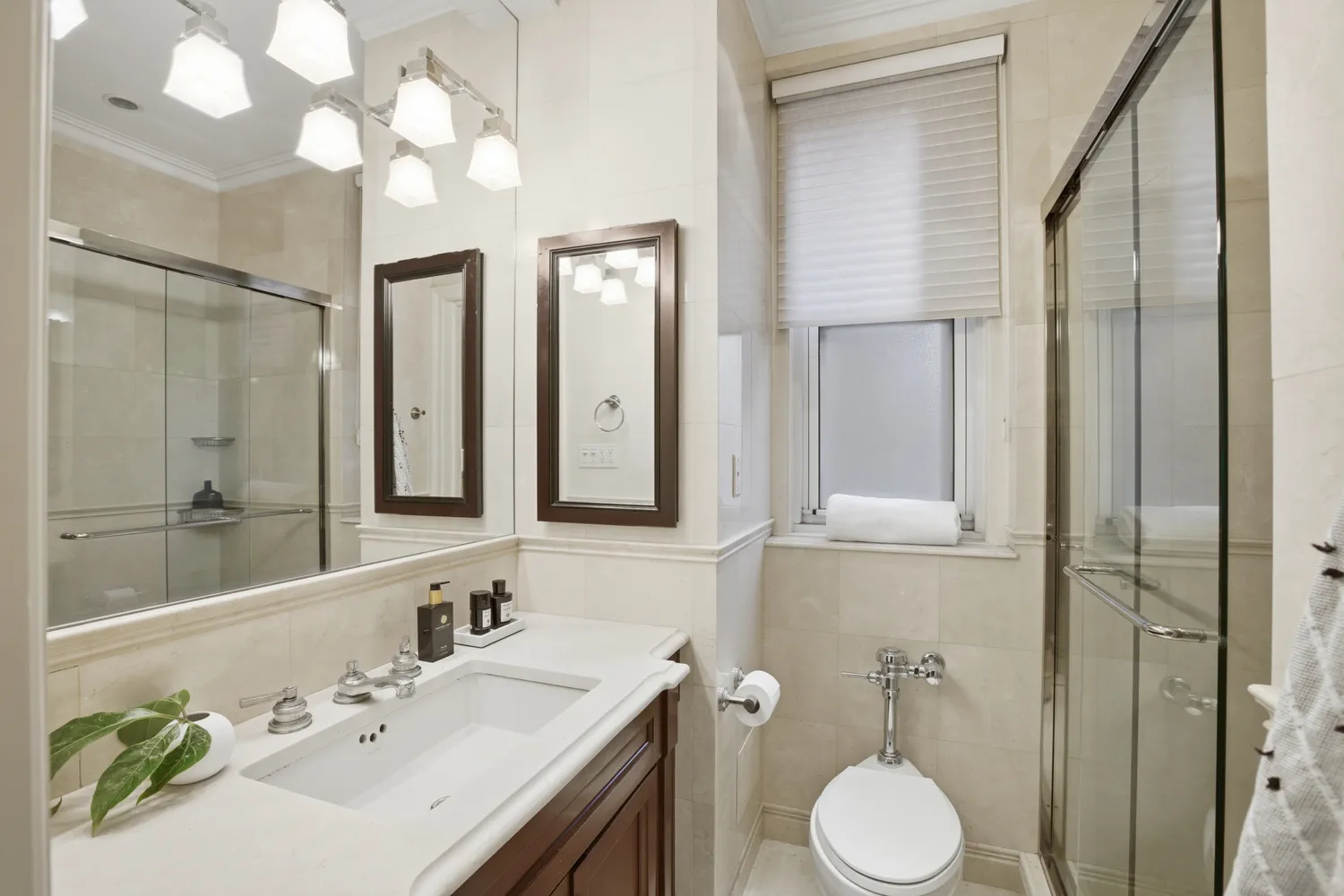 a bathroom with a sink vanity granite and a mirror