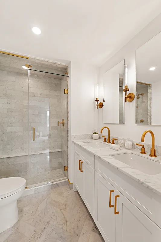 2 5th Avenue, Unit PHC Manhattan, NY 10011 - Photo 8 of 13 a bathroom with a sink a toilet and shower