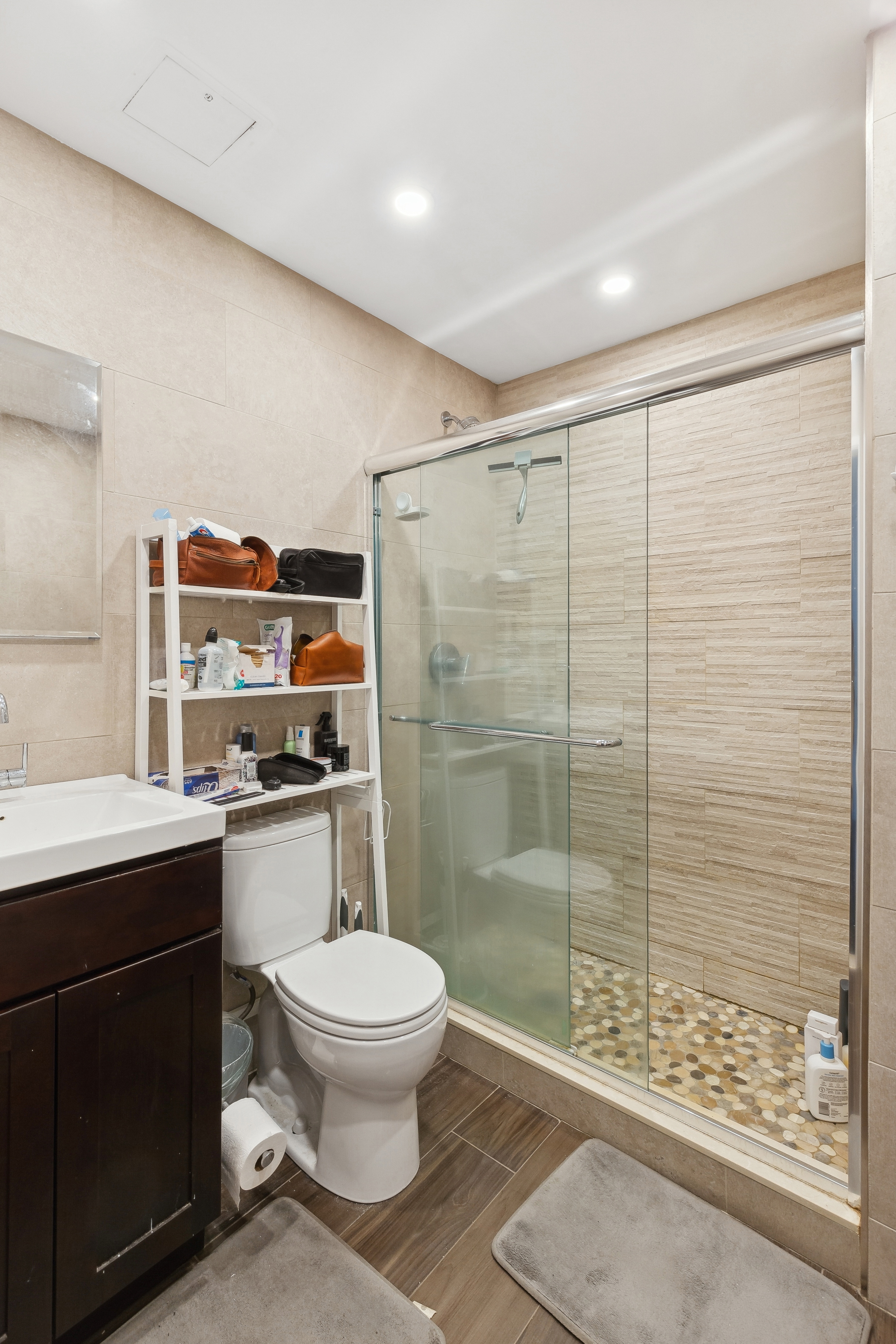 131 North 6th Street, Unit 4 Brooklyn, NY 11249 - Photo 5 of 6 a bathroom with a toilet a sink and shower