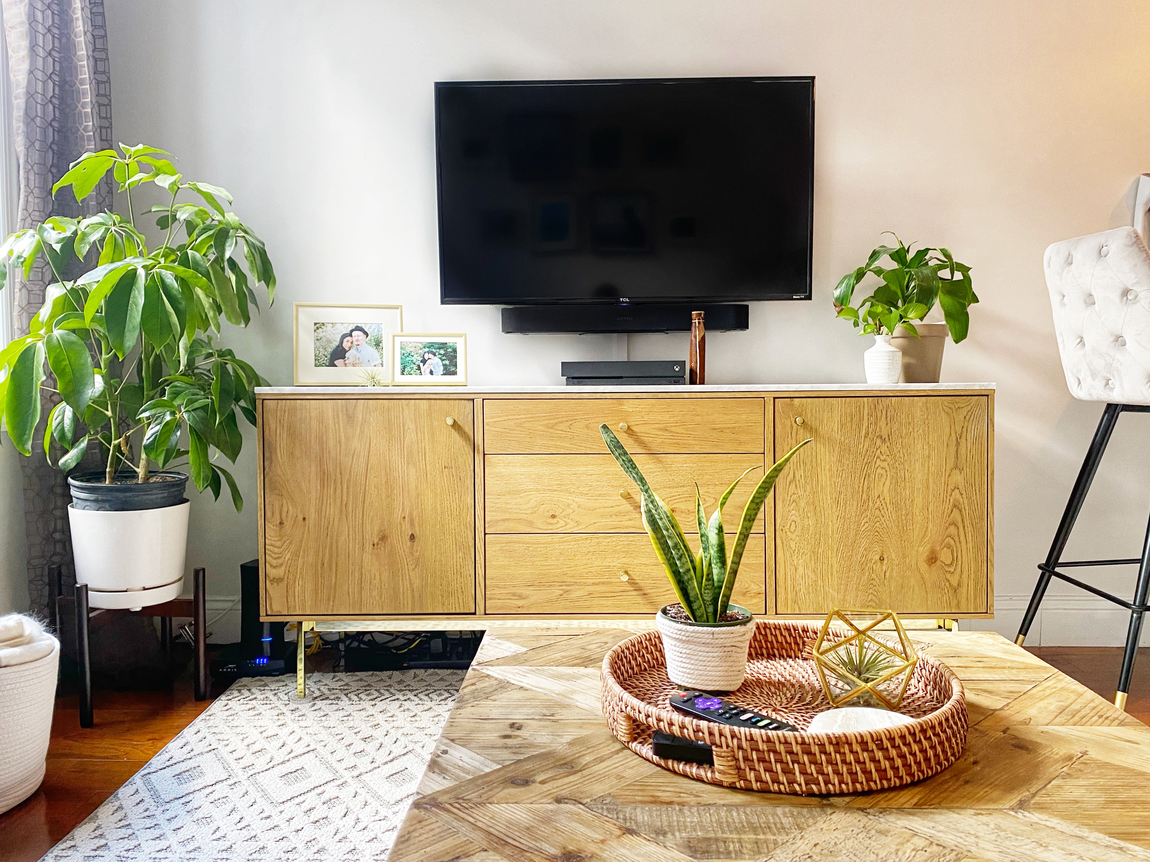 406 West 46th Street, Unit 4C Manhattan, NY 10036 - Photo 3 of 9 a living room with a couch and a potted plant