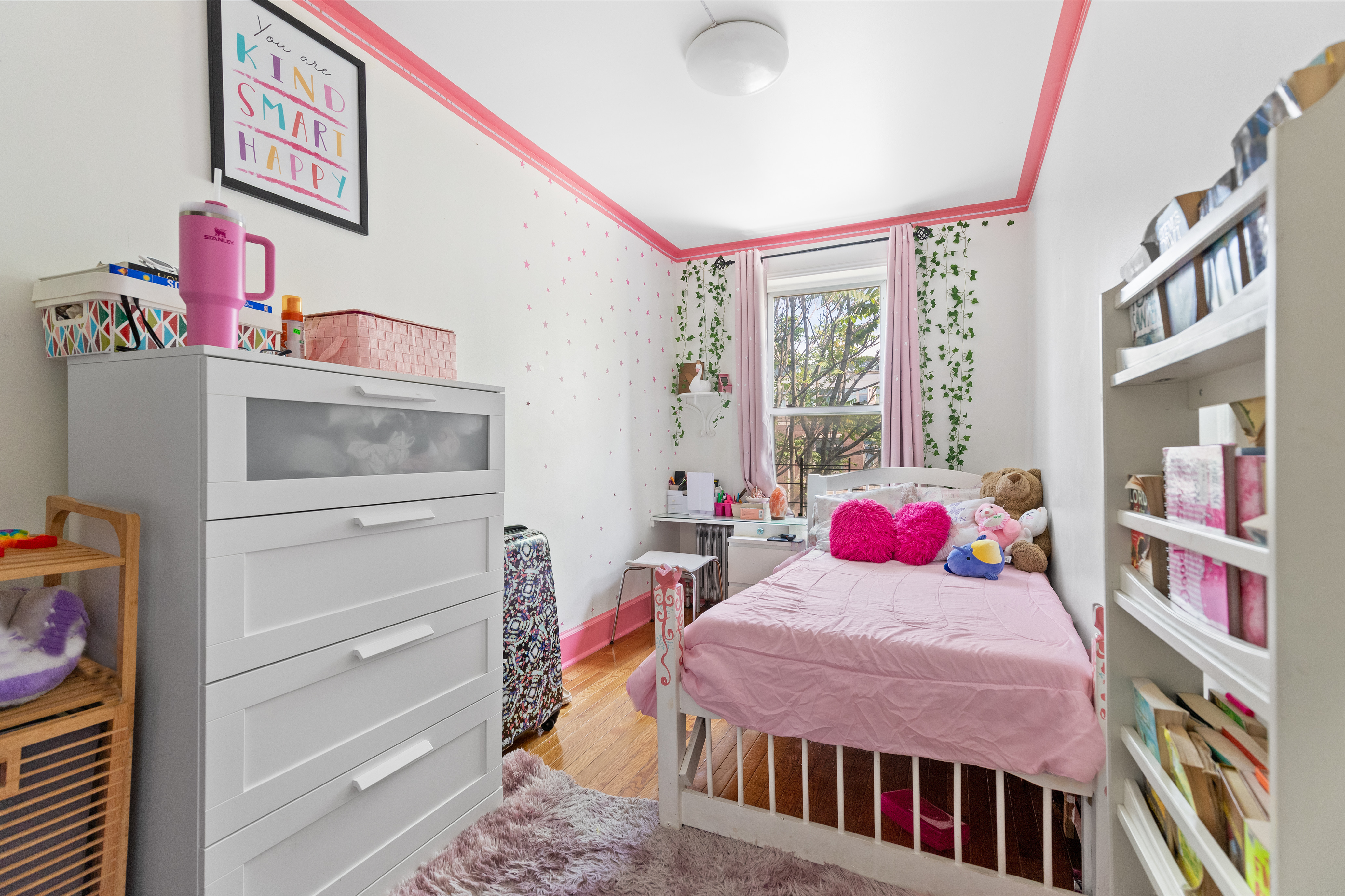 300 Gates Avenue Brooklyn, NY 11216 - Photo 7 of 13 a bedroom with a bed closet and a window