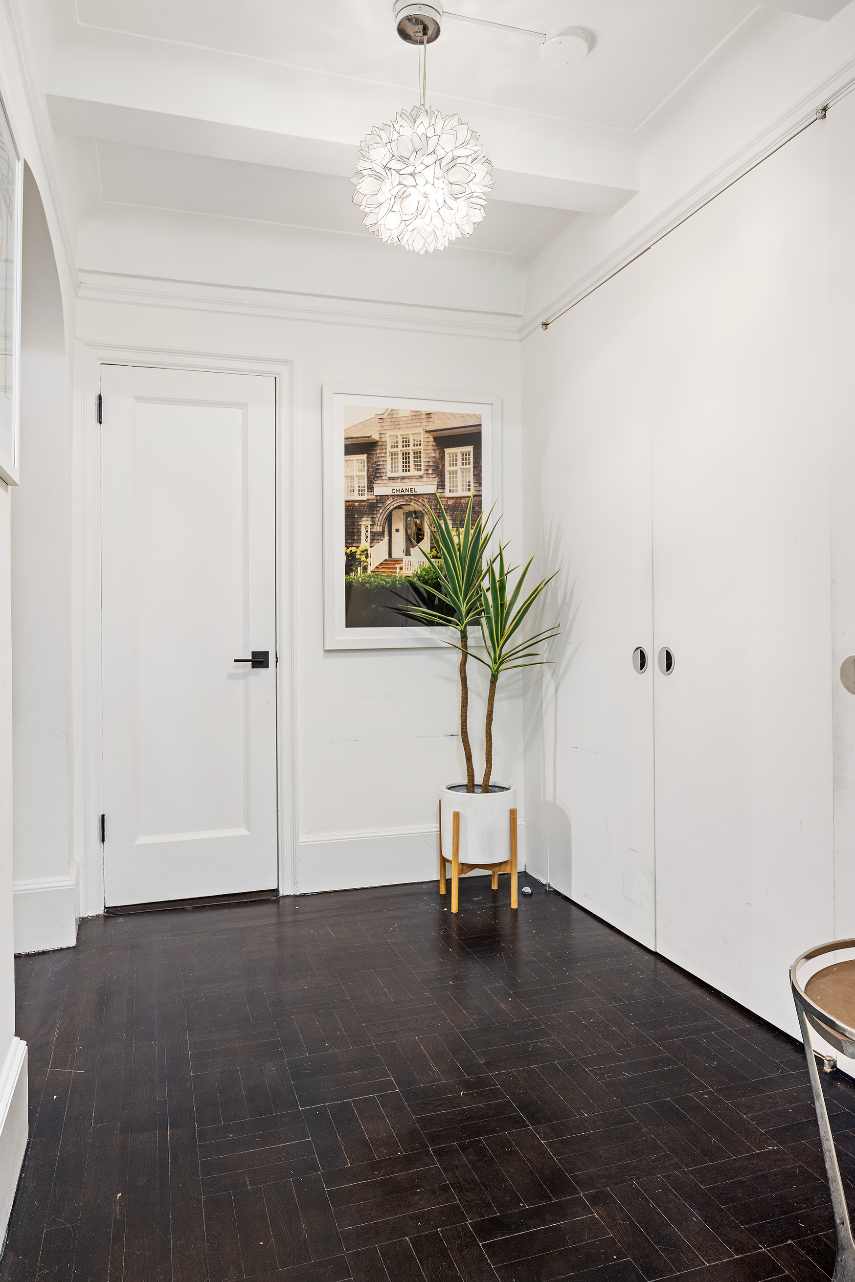 325 East 79th Street, Unit 6C Manhattan, NY 10075 - Photo 14 of 17 a living room with furniture and a chandelier