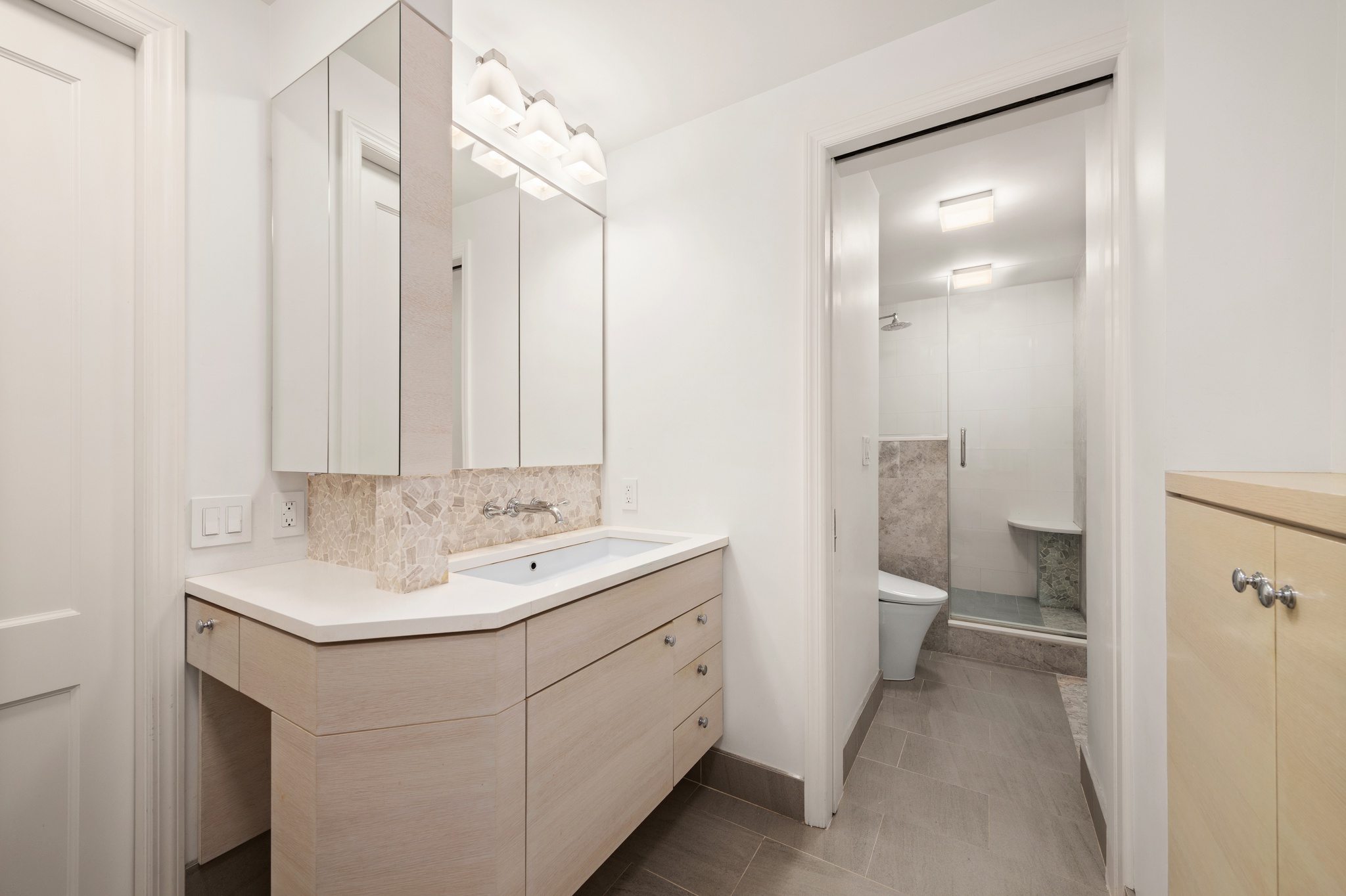 10 West 15th Street, Unit 1027/1028 Manhattan, NY 10011 - Photo 7 of 15 a bathroom with a sink toilet and shower