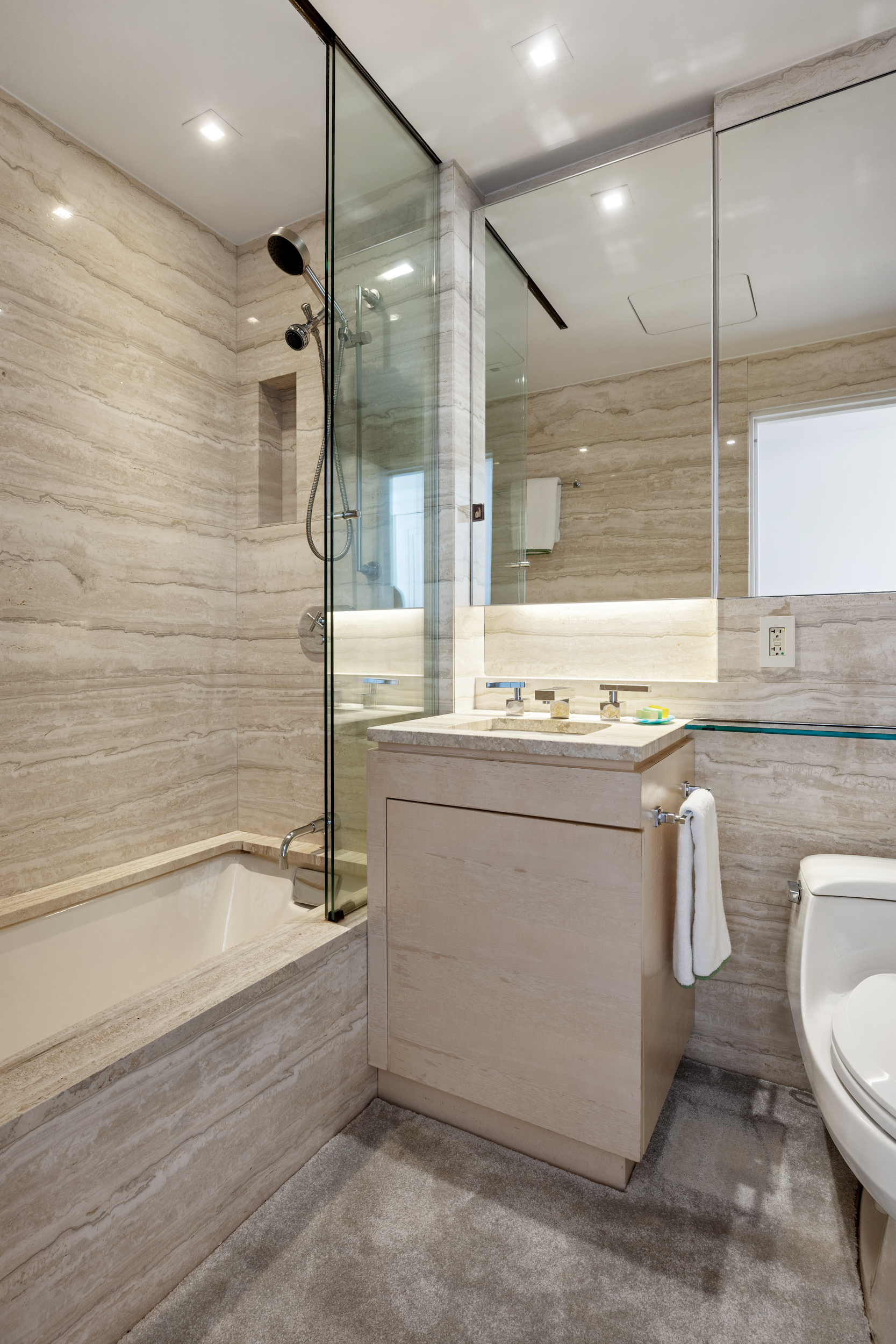 170 East End Avenue, Unit 8EF Manhattan, NY 10128 - Photo 25 of 34 a bathroom with a granite countertop sink mirror toilet and bathtub