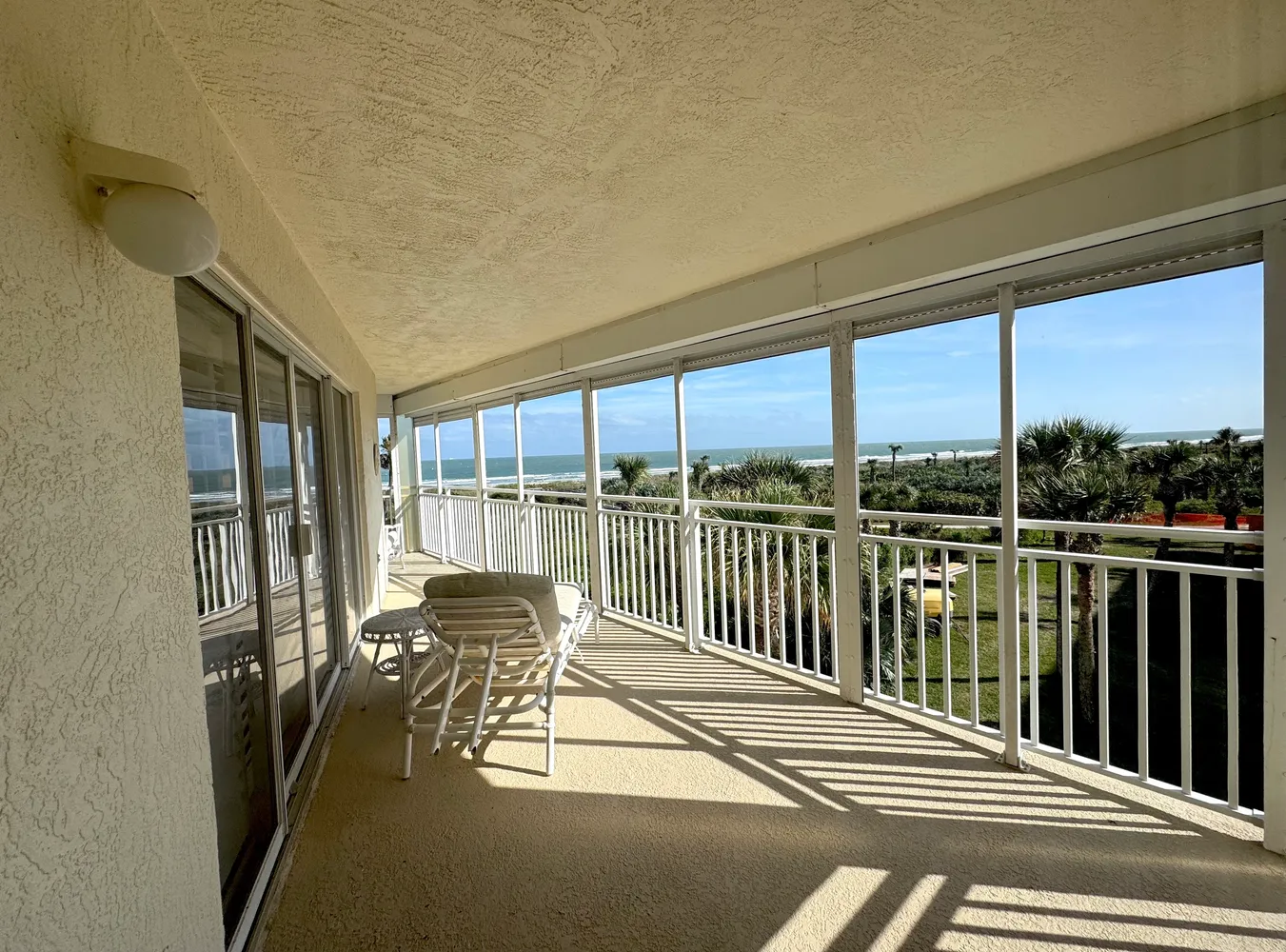 a view of balcony with furniture