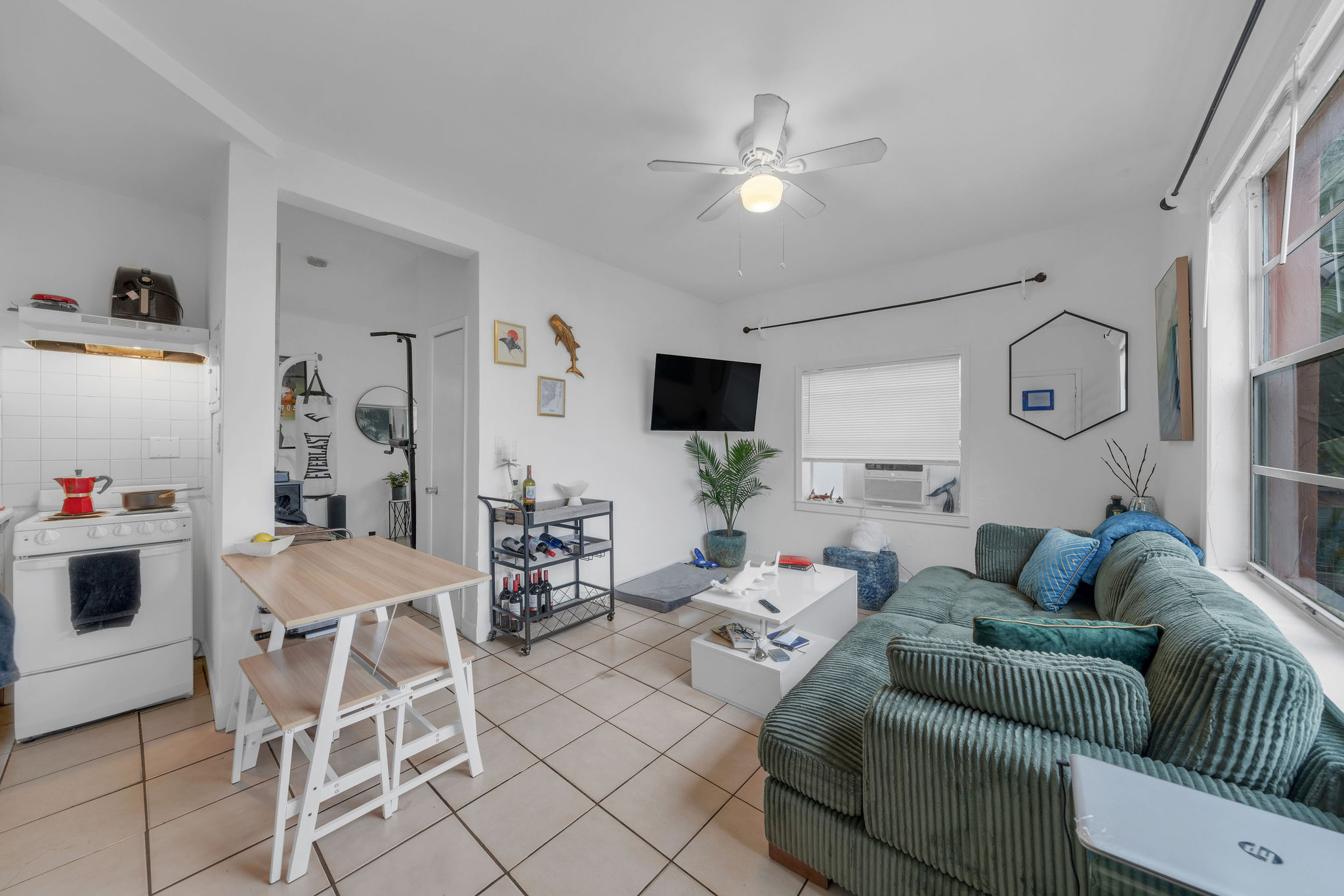 735-745 Meridian Avenue Miami Beach, FL 33139 - Photo 31 of 62 a living room with furniture and a flat screen tv