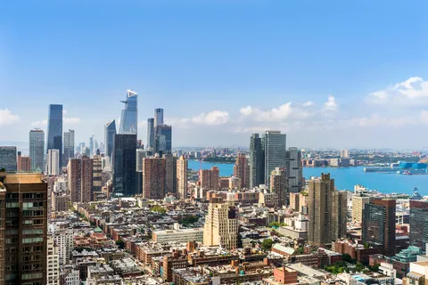 a view of a city with tall buildings