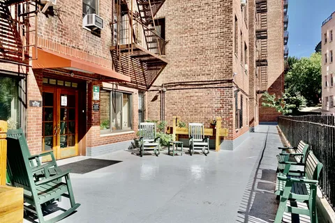 a view of balcony with couch and chairs