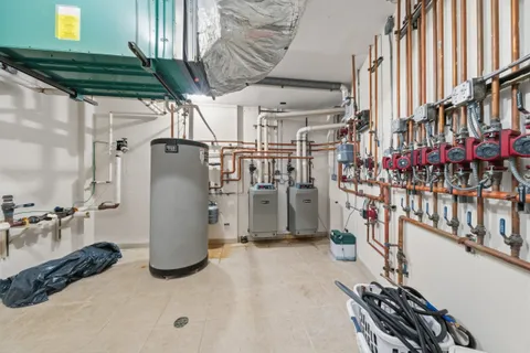 a view of a closet with wooden floor