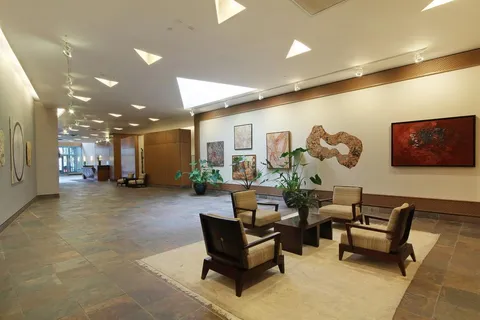 a living room with furniture and a table