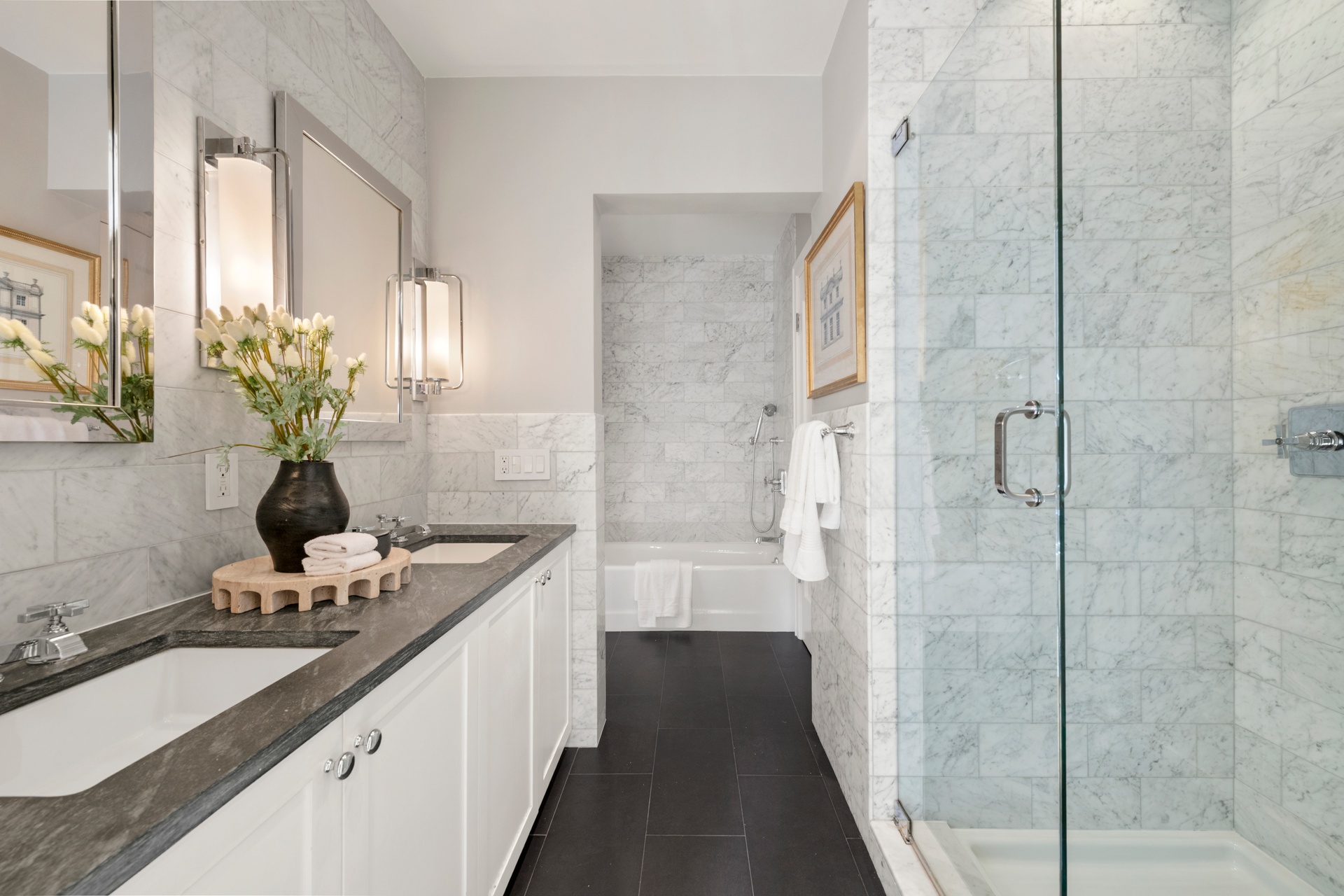 30 West 13th Street, Unit 4C Manhattan, NY 10011 - Photo 14 of 22 a bathroom with a double vanity sink a large mirror and a shower