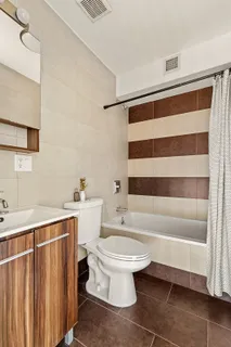 a bathroom with a toilet a sink and a bathtub