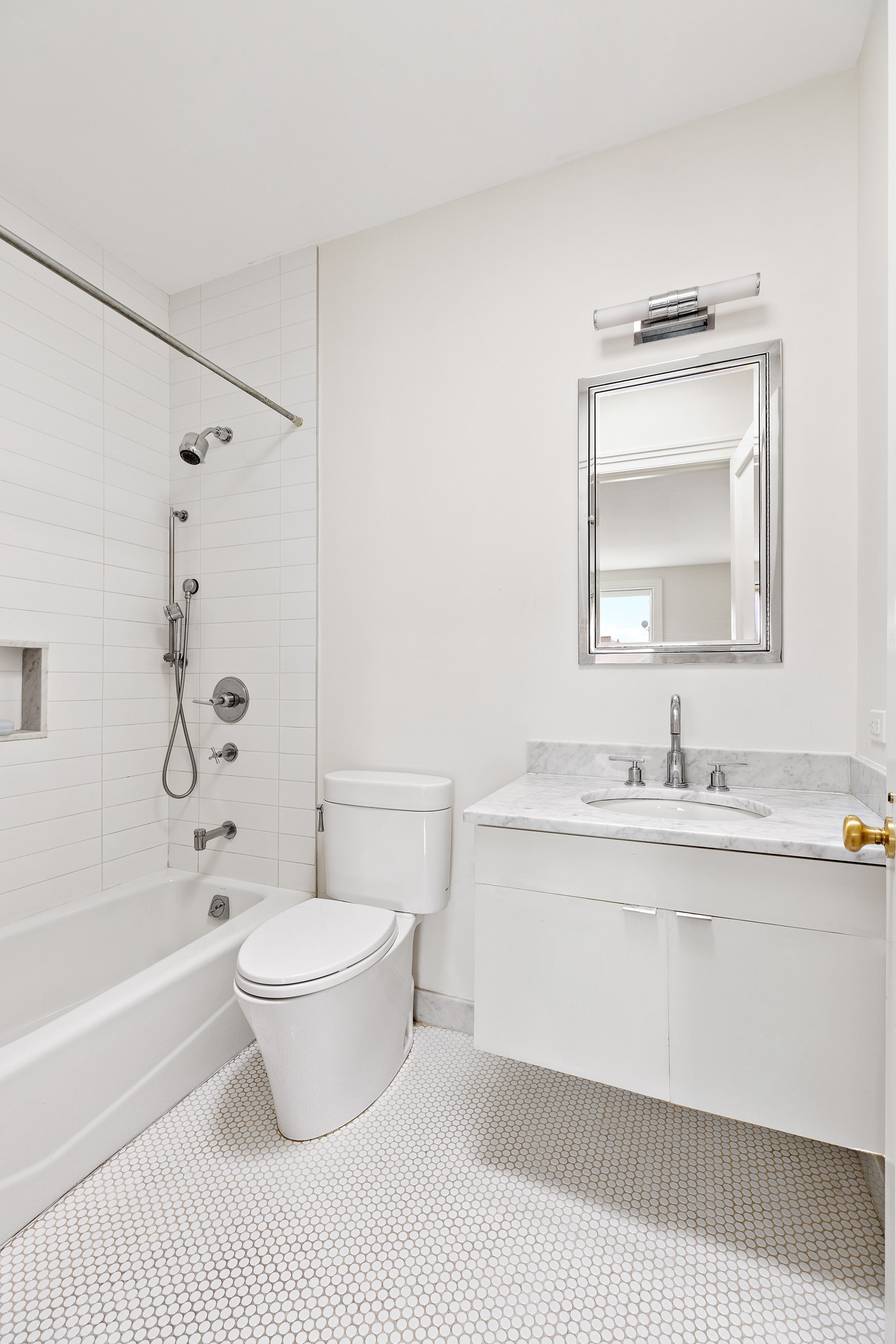 126 Pacific Street Brooklyn, NY 11201 - Photo 14 of 16 a bathroom with a granite countertop toilet a sink and a bathtub