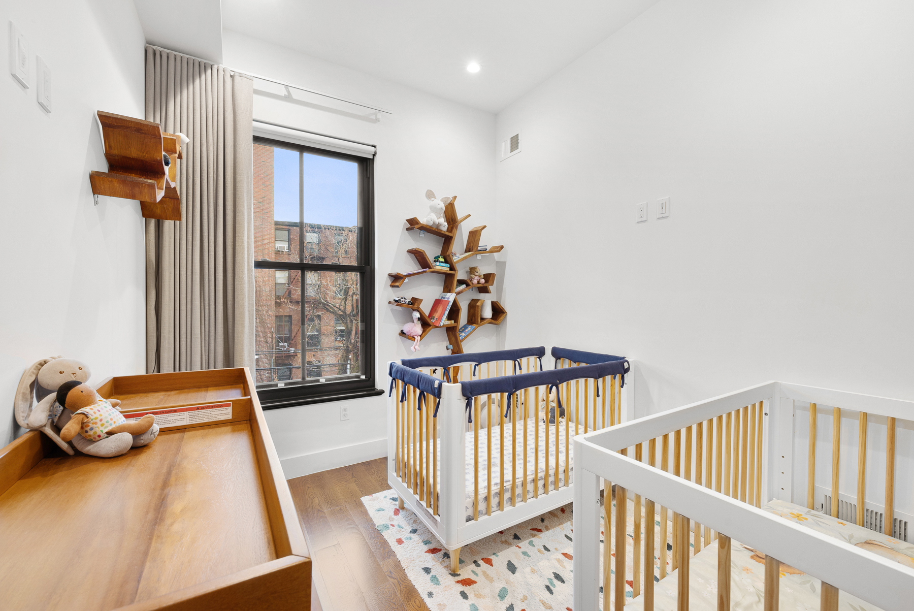 110 Summit Street, Unit 2 Brooklyn, NY 11231 - Photo 9 of 13 a bedroom with furniture and a window