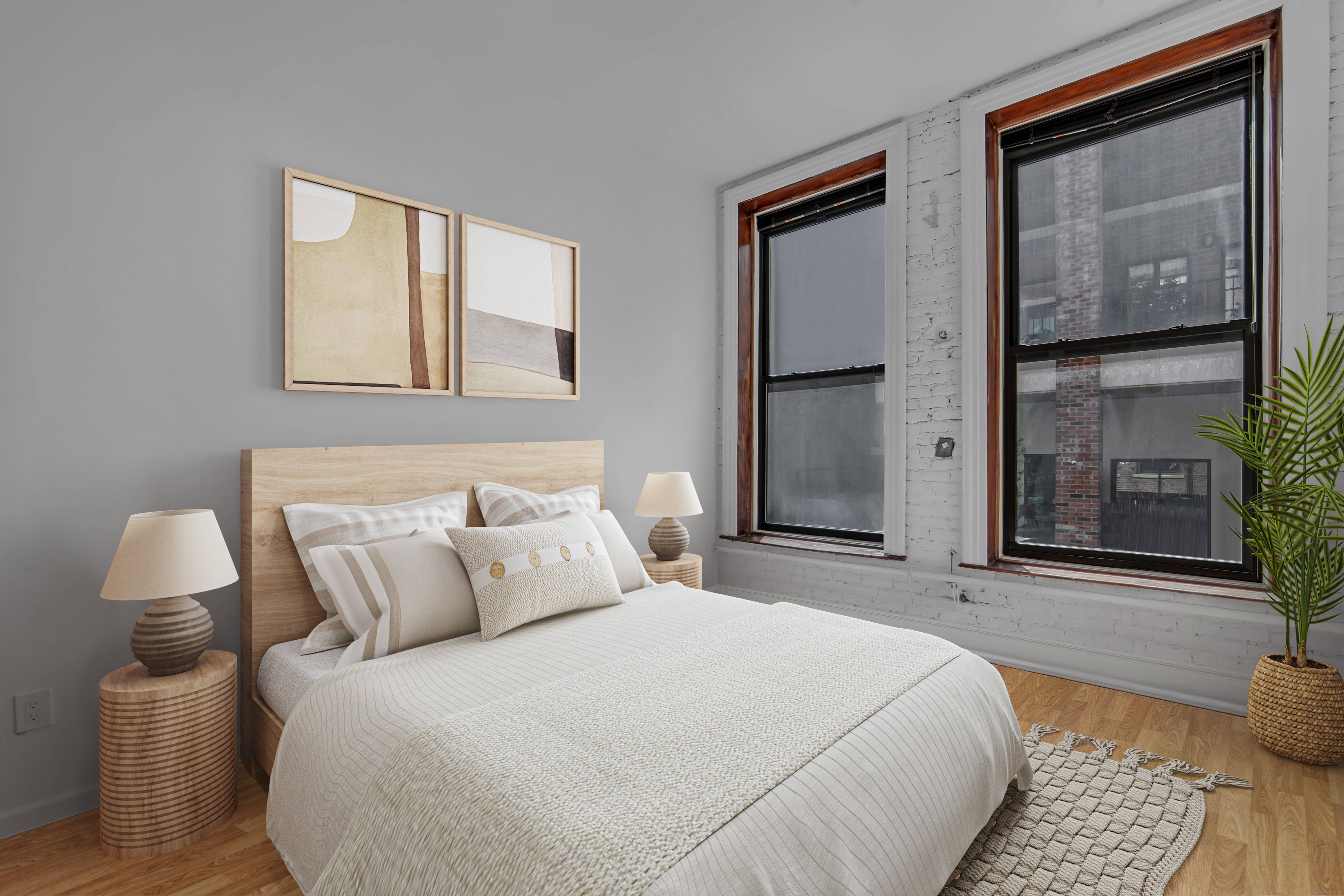 56 East 11th Street, Unit 7 Manhattan, NY 10003 - Photo 14 of 18 a bedroom with a bed and a mirror