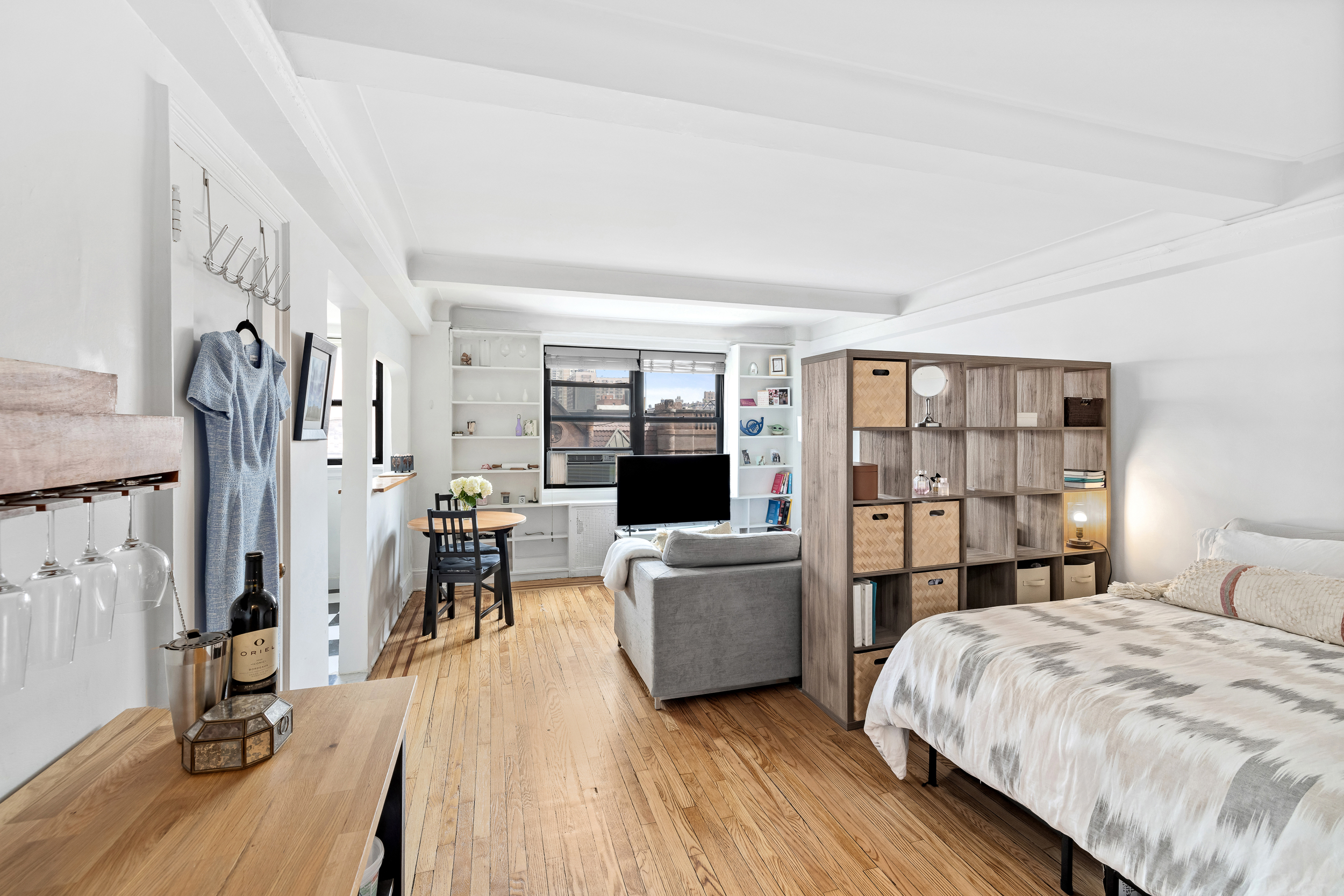 102 West 85th Street, Unit 9B Manhattan, NY 10024 - Photo 4 of 7 a living room with furniture and a flat screen tv