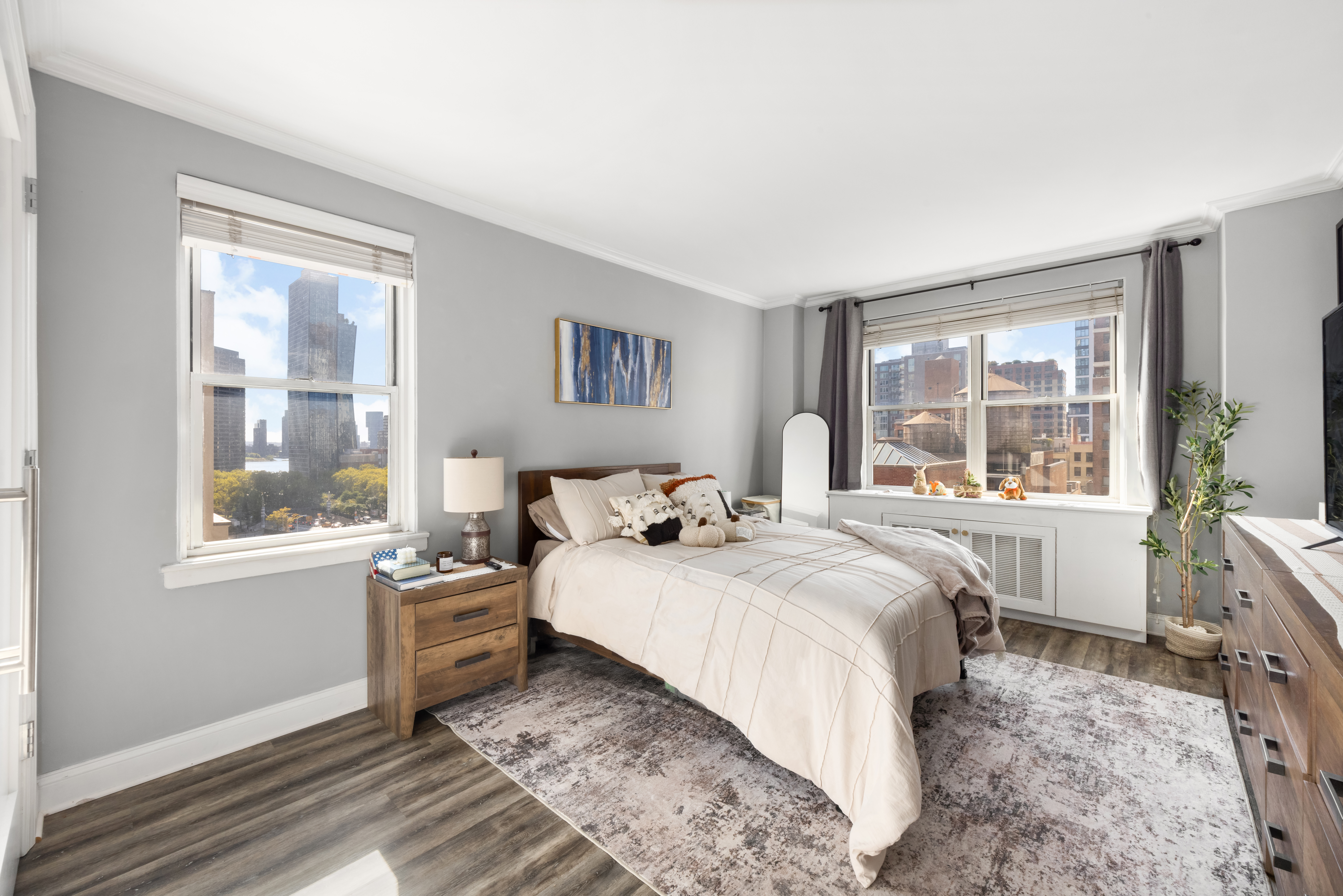 201 East 37th Street, Unit 11B Manhattan, NY 10016 - Photo 2 of 6 a bedroom with a large bed and a window