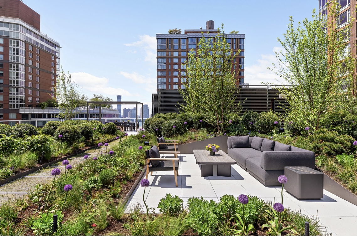 210 Warren Street, Unit 10G Manhattan, NY 10282 - Photo 13 of 15 a view of a city with tall buildings