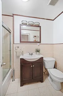 a bathroom with a sink toilet and tub