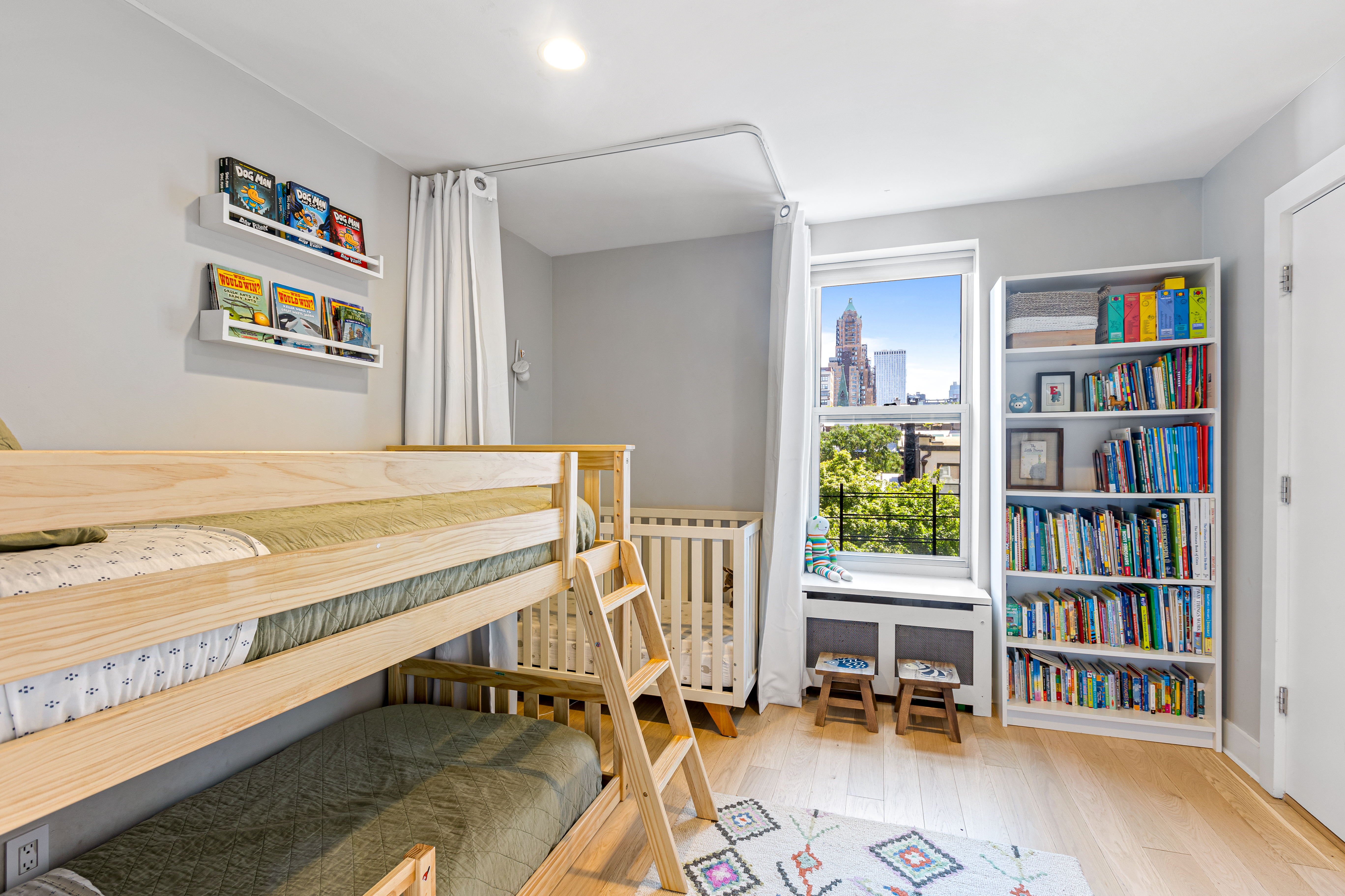 277 Hicks Street, Unit 4D Brooklyn, NY 11201 - Photo 10 of 15 a view of a workspace with furniture and a book shelf