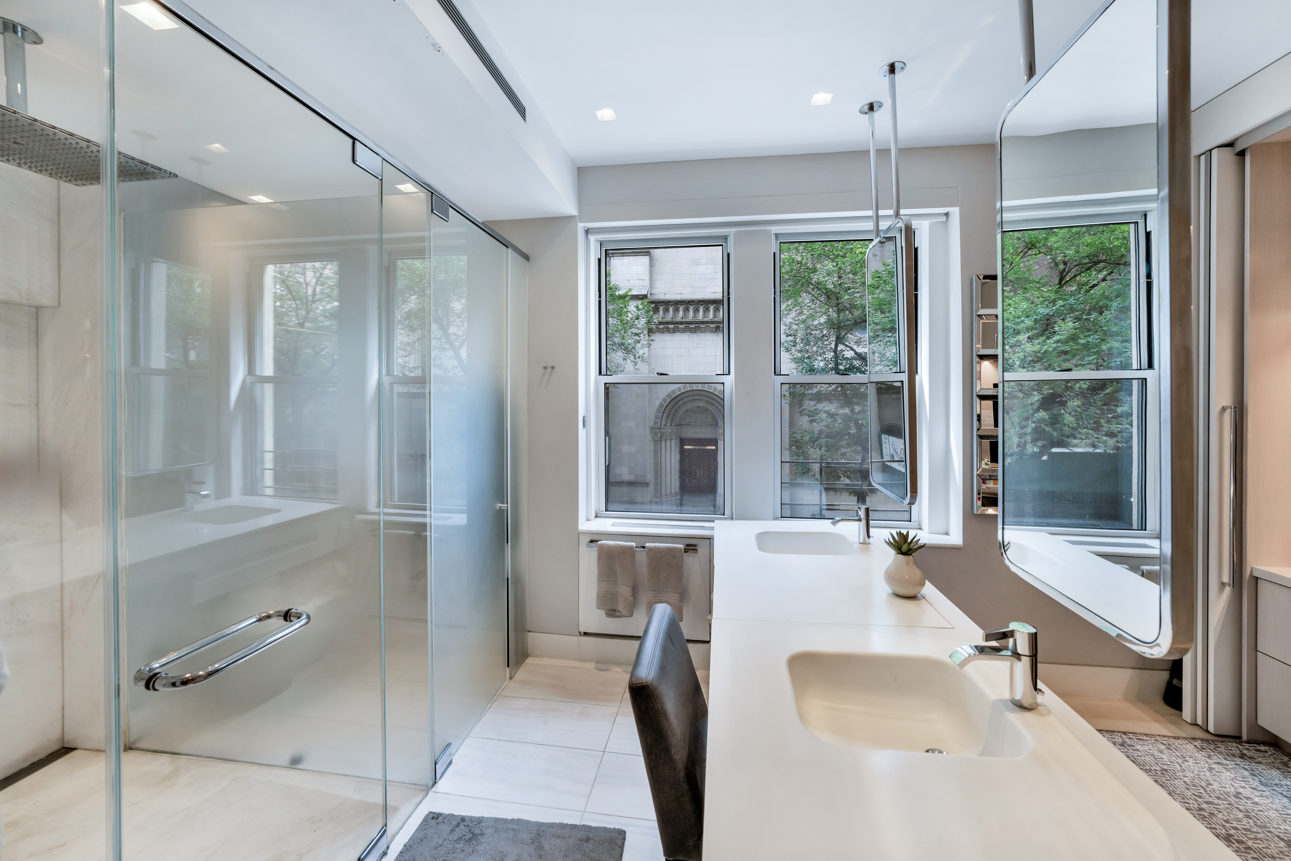67 Park Avenue, Unit 2BC Manhattan, NY 10016 - Photo 8 of 16 a large spacious bathroom with a large tub shower and sink