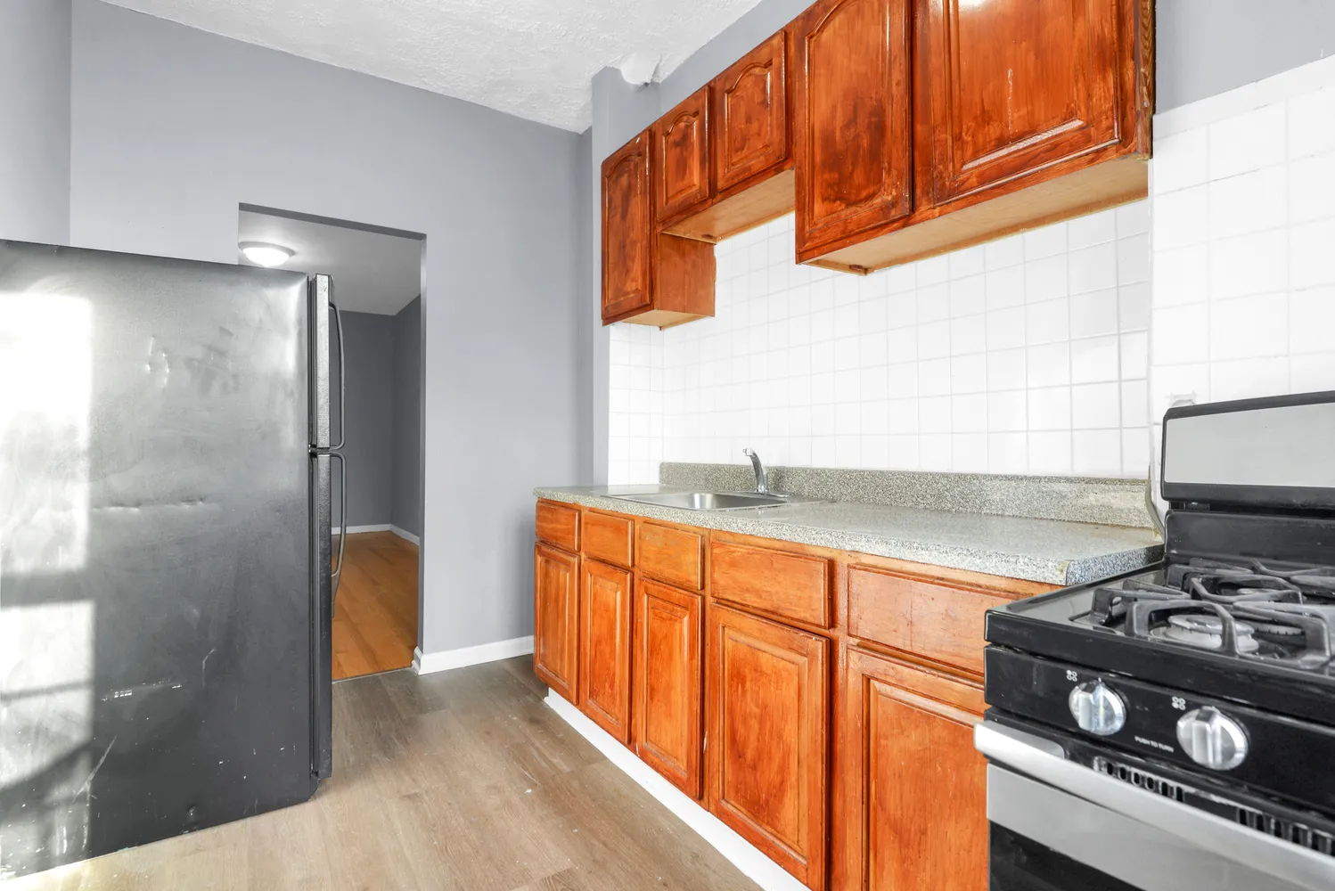a view of a bathroom from a corridor