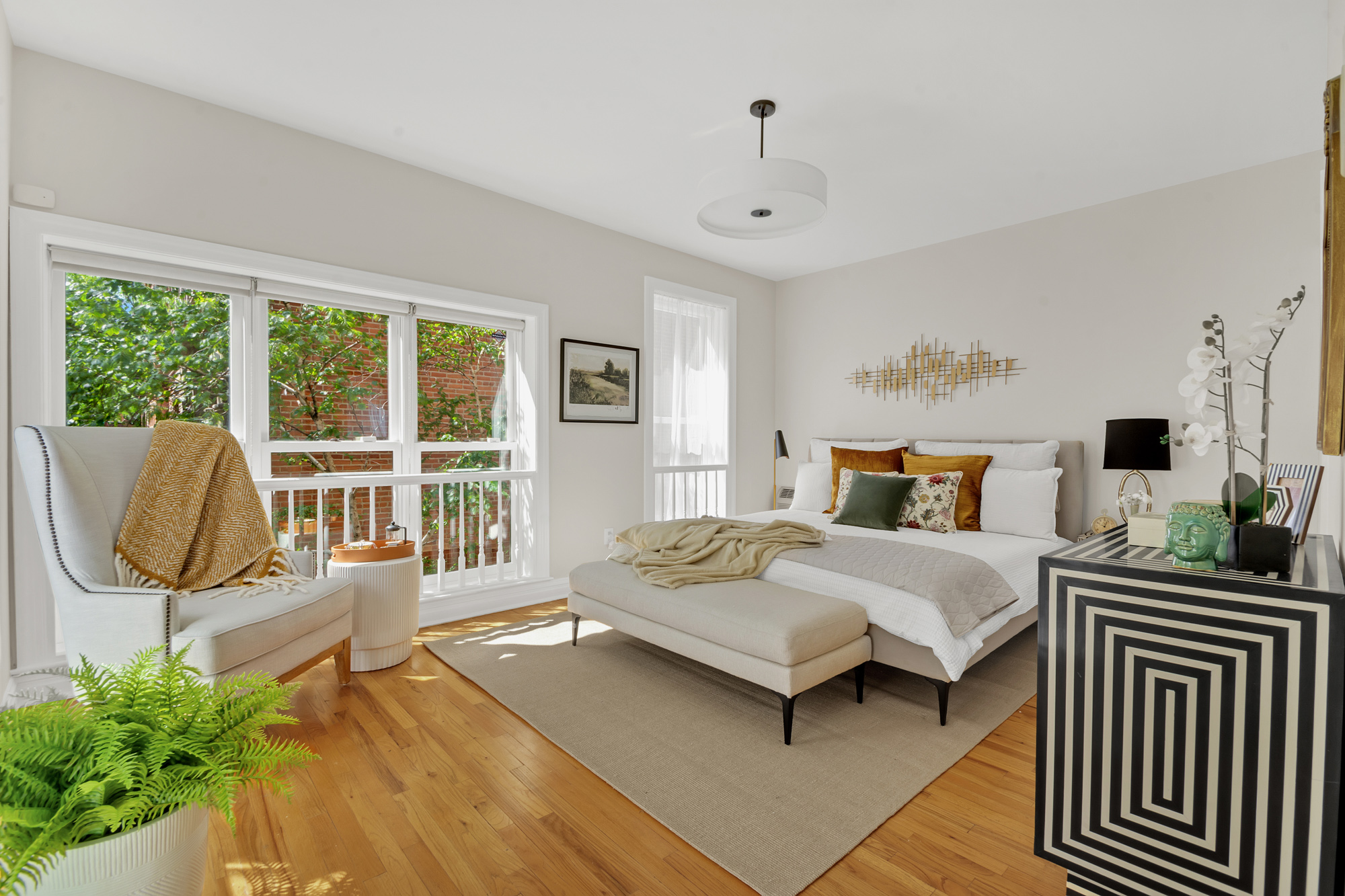 1 Mount Morris Park West, Unit 1A Manhattan, NY 10027 - Photo 6 of 12 a bedroom with a large bed and a window