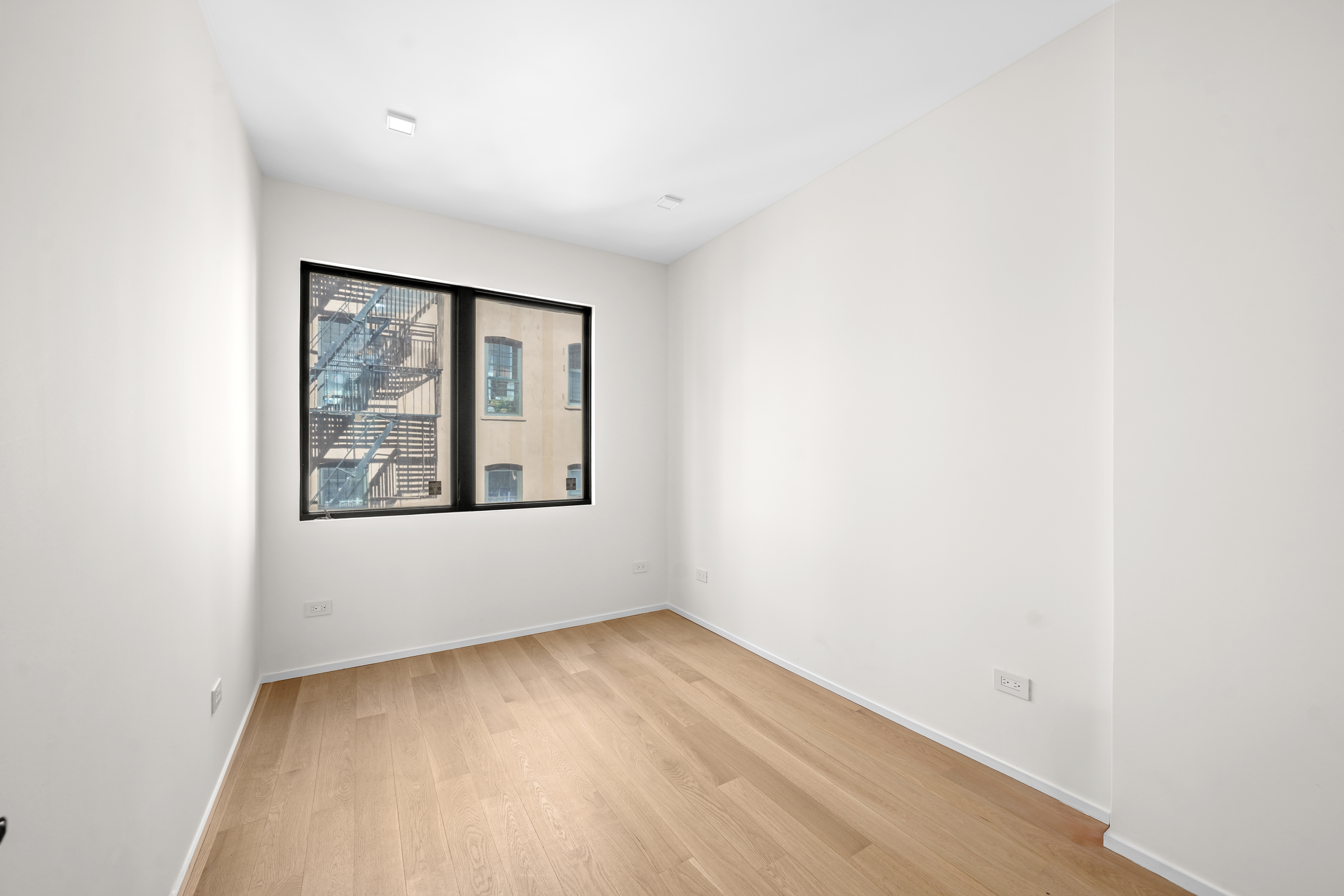 953 St Nicholas Avenue, Unit 1 Manhattan, NY 10032 - Photo 8 of 15 a view of an empty room with a window