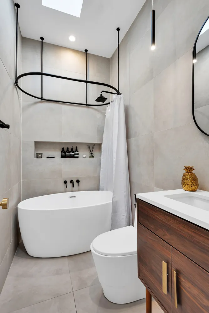 a bathroom with a sink a mirror and a toilet