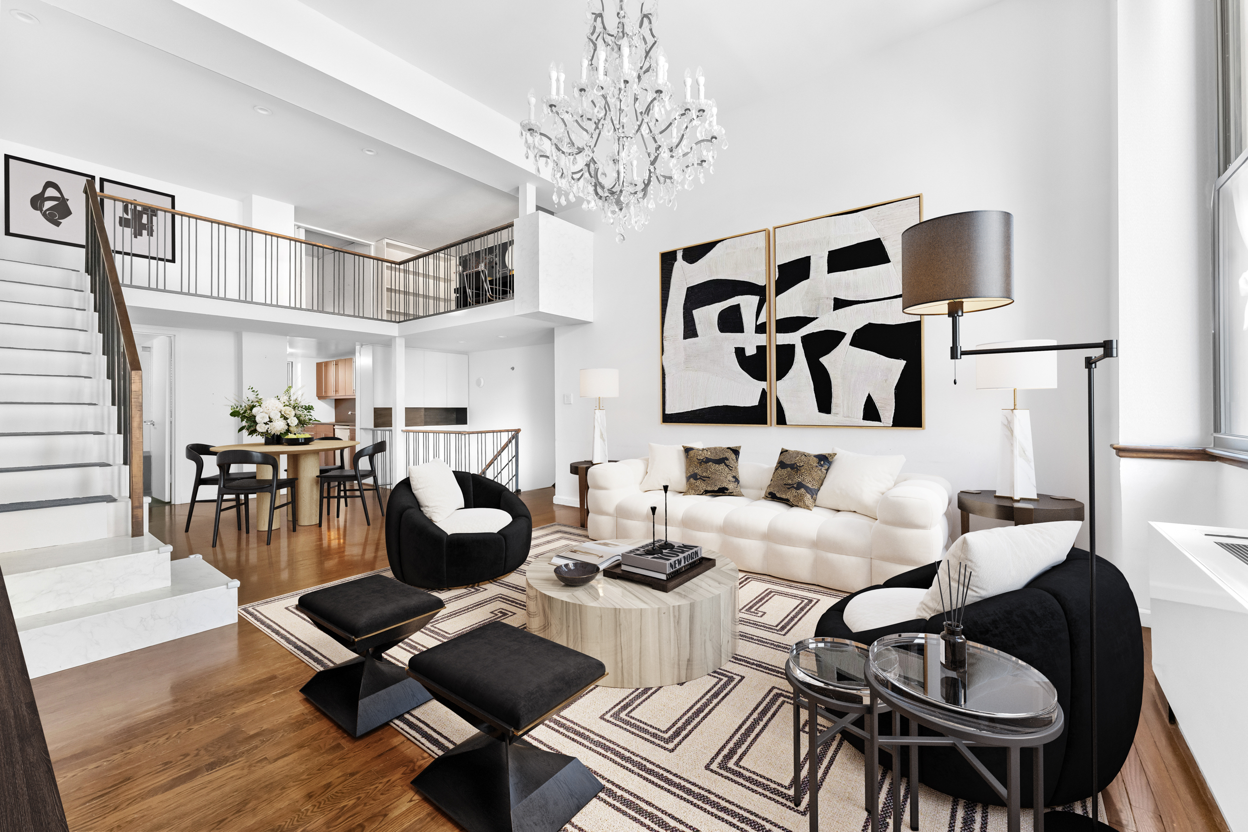 305 2nd Avenue, Unit 320 Manhattan, NY 10003 - Photo 1 of 16 a living room with furniture kitchen view and a chandelier