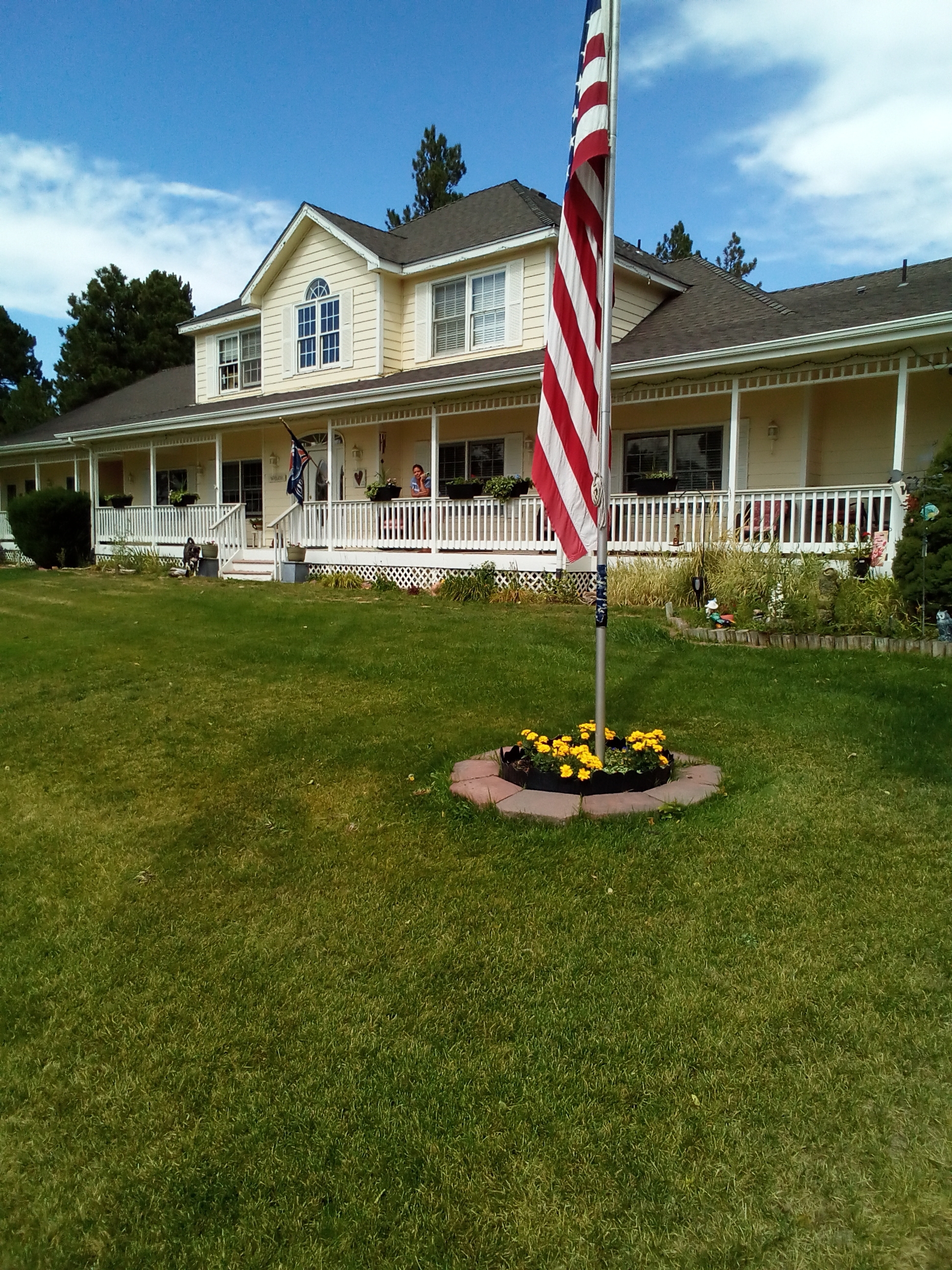 7550 North Village Road Parker, CO 80134 - Photo 2 of 13 a front view of a house with a yard