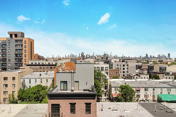 605 Hart Street, Unit 606 Brooklyn, NY 11221 - Photo 9 of 10 a view of a city with tall buildings