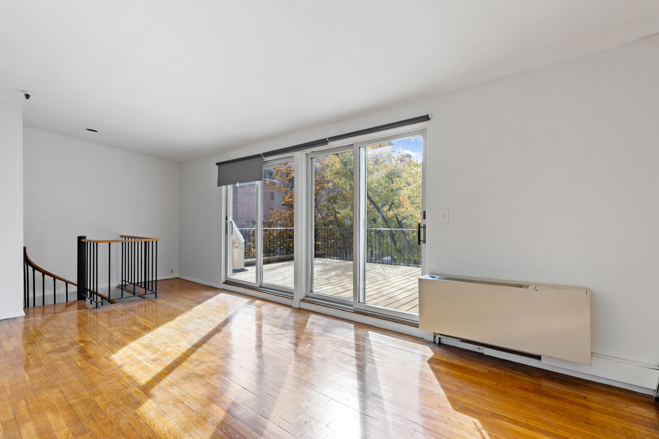 136 East 30th Street, Unit 3R Manhattan, NY 10016 - Photo 17 of 23 a view of a room with wooden floor and a window