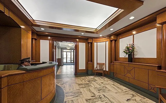 222 Riverside Drive, Unit 5D Manhattan, NY 10025 - Photo 6 of 8 a view of a hallway with furniture and floor to ceiling window